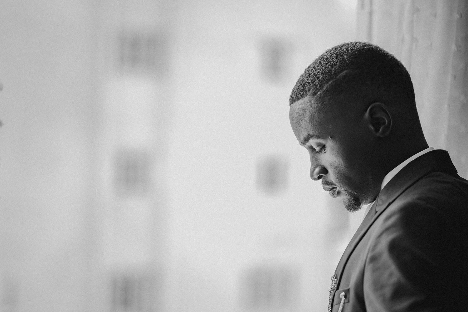 Black and white portrait showing contemplative moments before the ceremony.