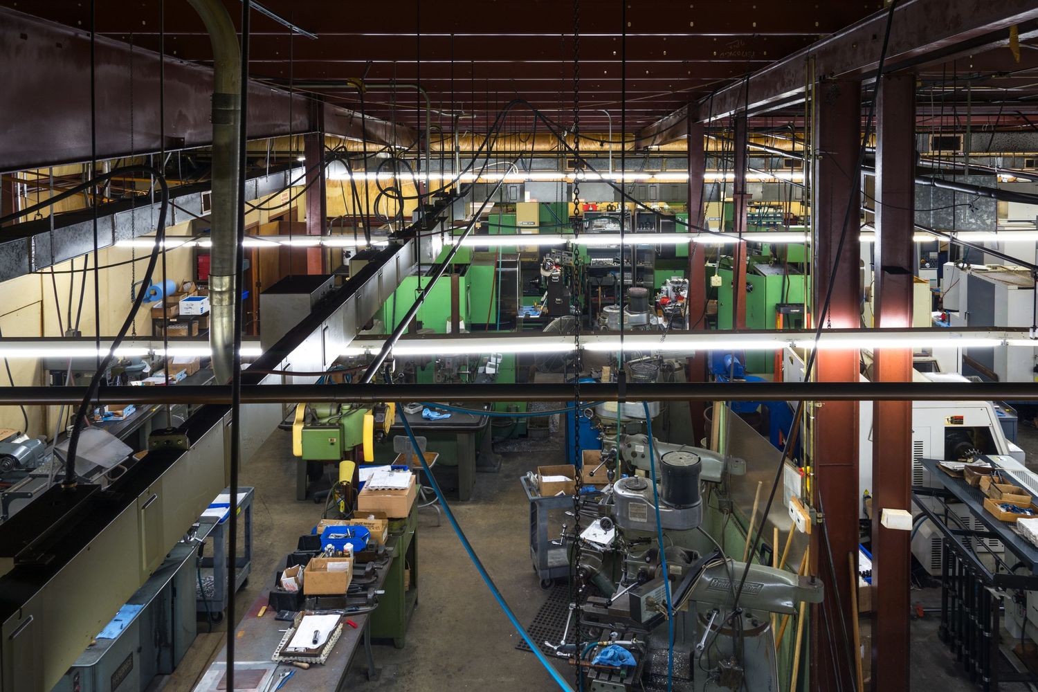Large industrial warehouse interior with high ceilings and storage racks.