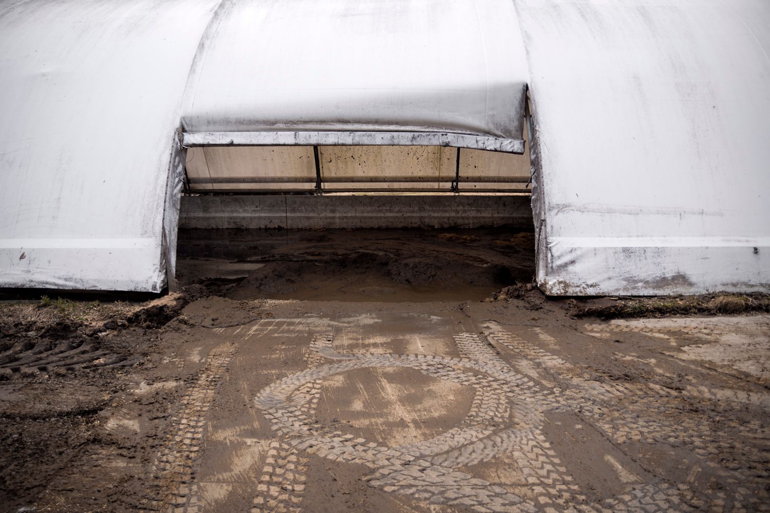 Empty concrete floor with worn patterns and marks in industrial space.