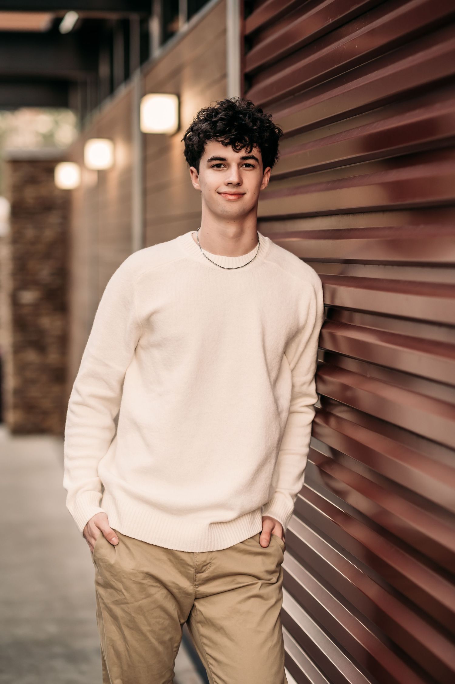 A senior takes his senior photos with Fallon Photography at Steven's Creek Nature Center in Charlotte, NC.