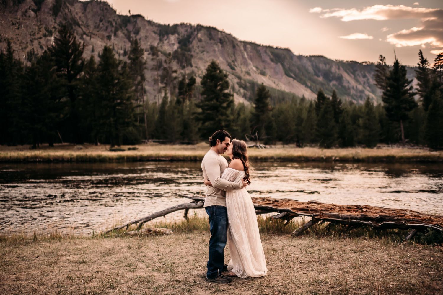 Couples sharing a moment in Yellowstone National Park captured by Charlotte Photographer, Fallon Photography.