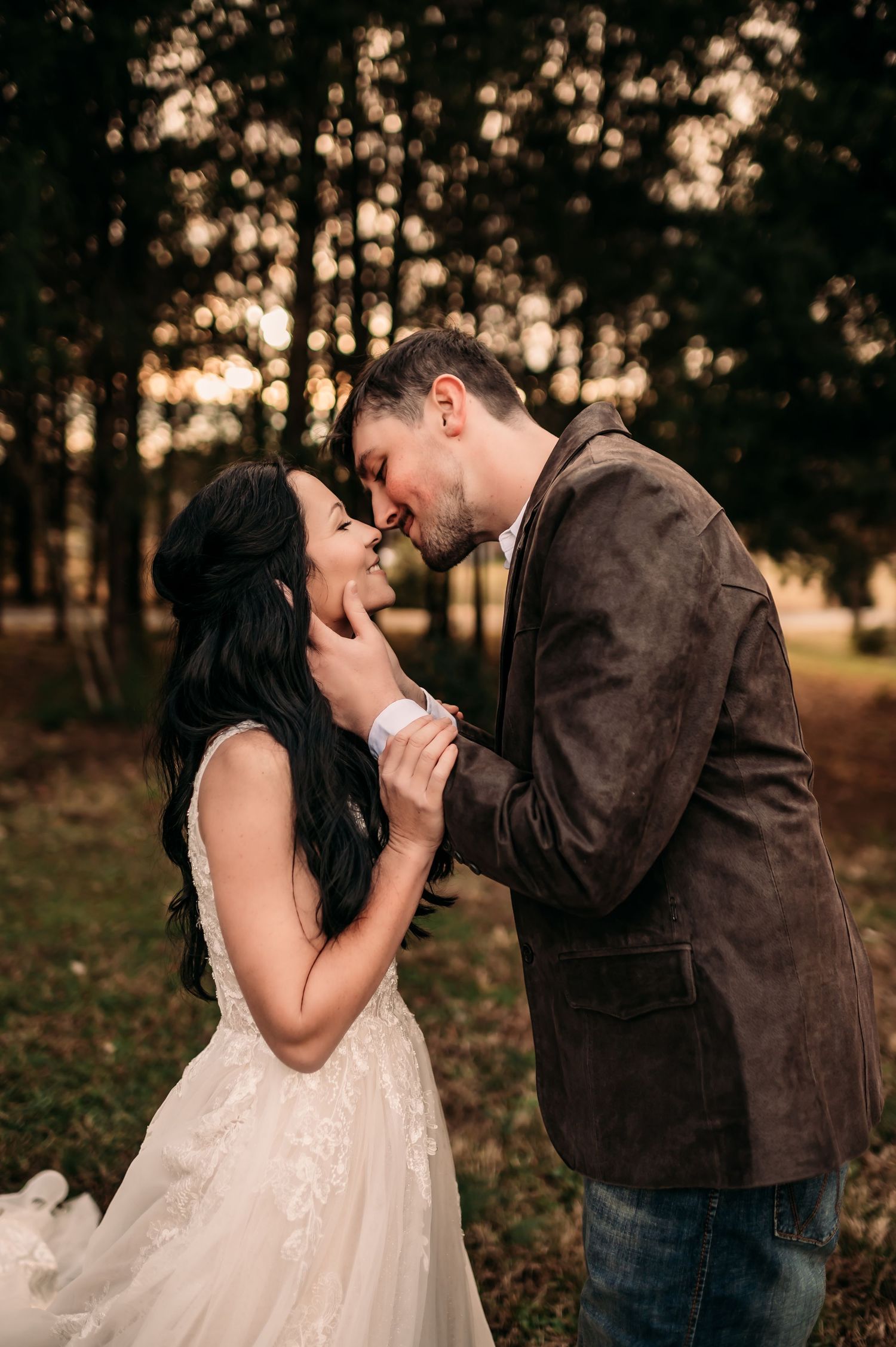 Newly married couple smiling and about kiss being captured by Fallon Photography in Charlotte, North Carolina.