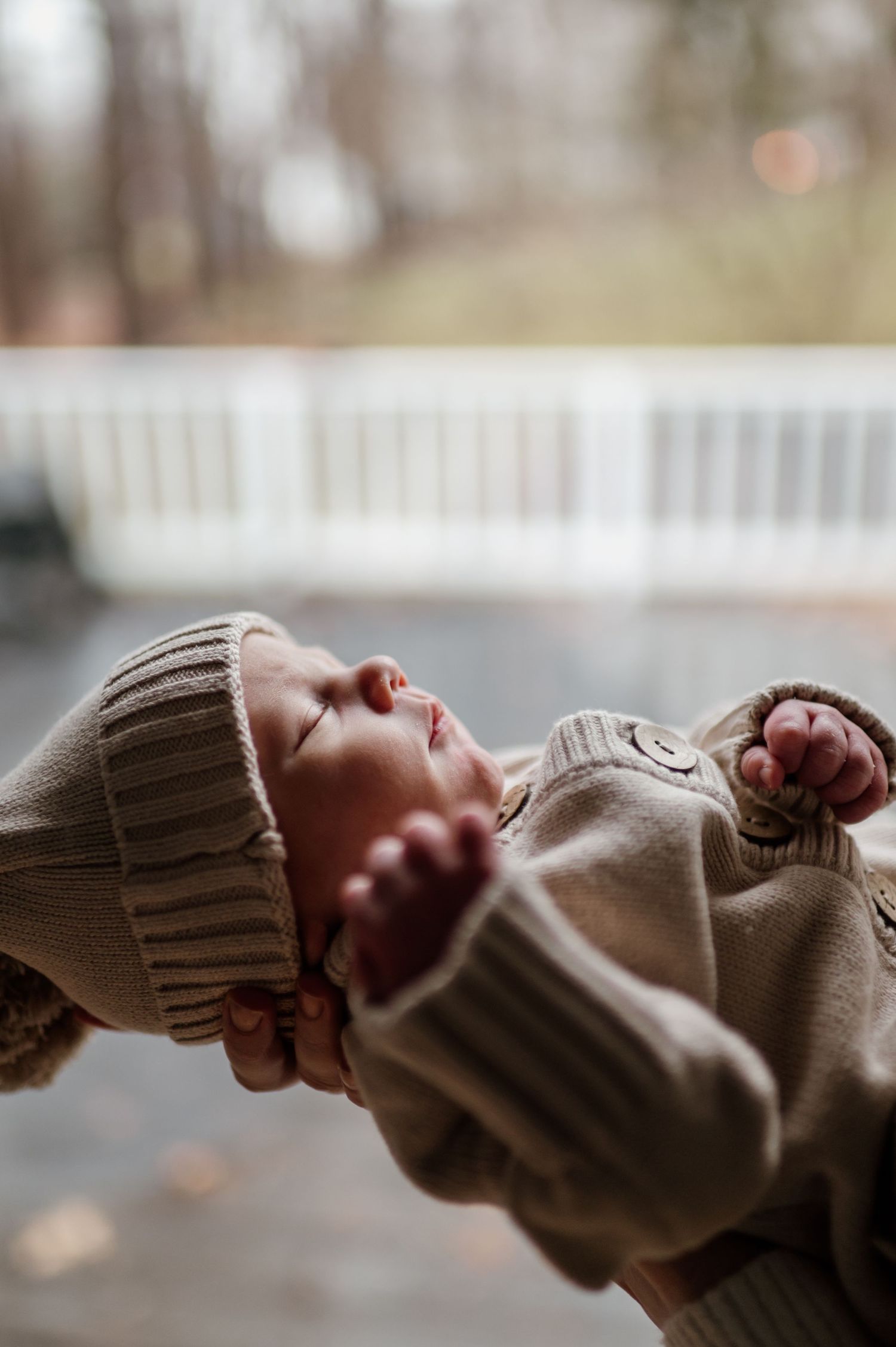 A series of close-up shots showing hands in knit sweaters reaching toward each other.