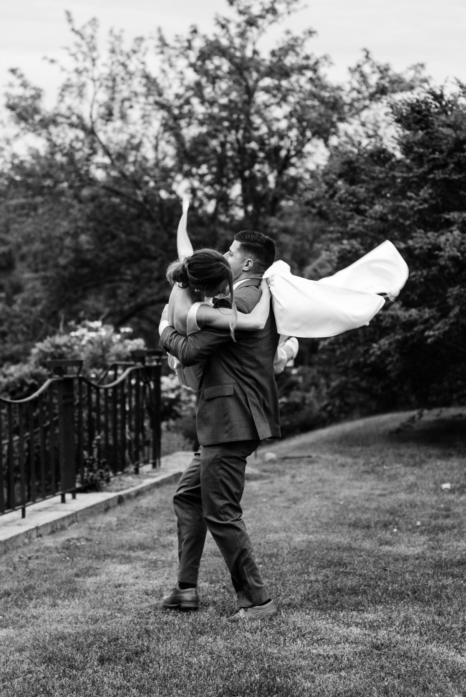 A black and white photo sequence shows a person throwing a white cloth in a grassy outdoor setting.