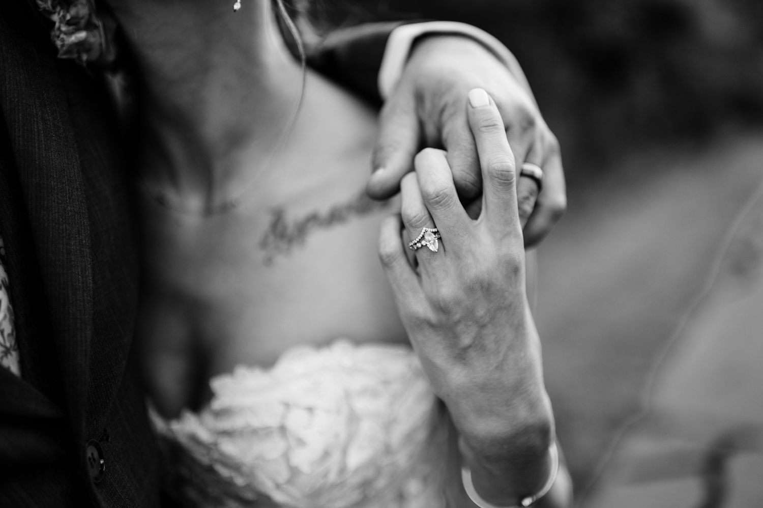Black and white close-up wedding photography capturing intimate moments.