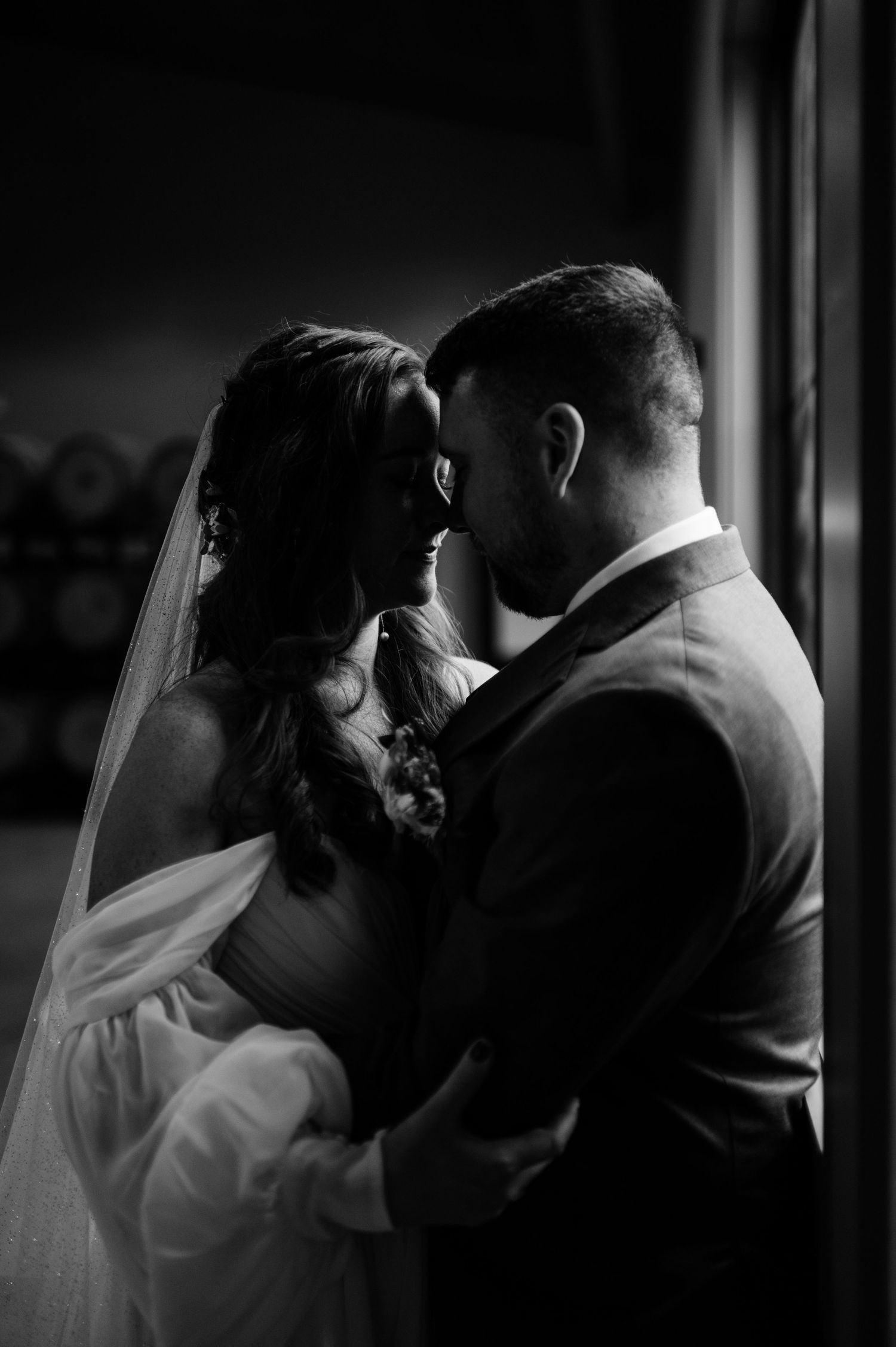Romantic silhouetted wedding photos showing intimate moments between a bride and groom.