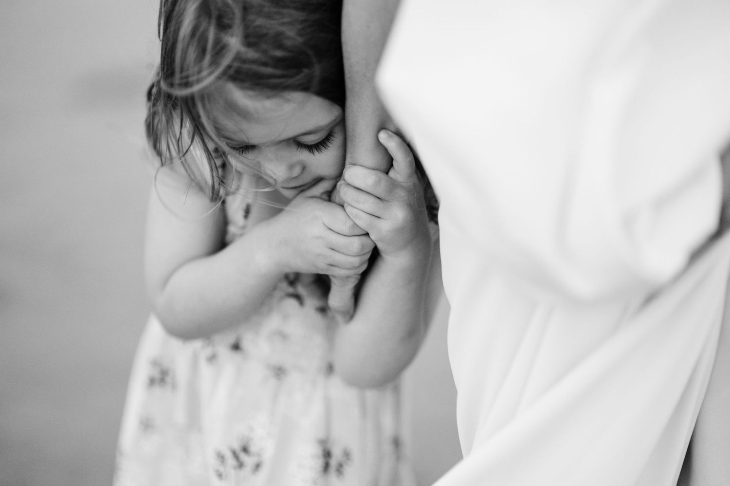 Tender black and white portrait series showing emotional intimate moments.