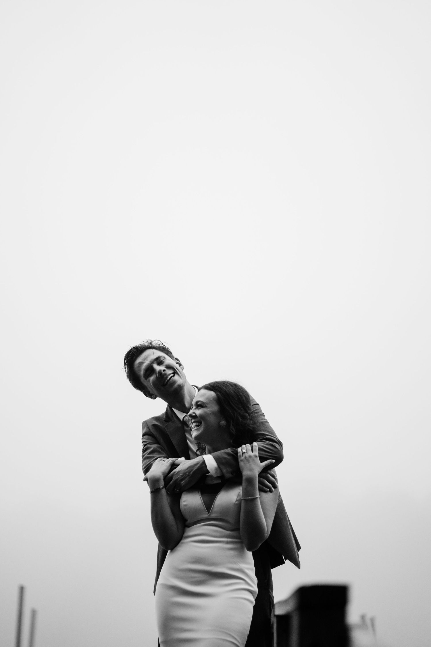 Black and white portrait series showing joyful expressions and laughter.