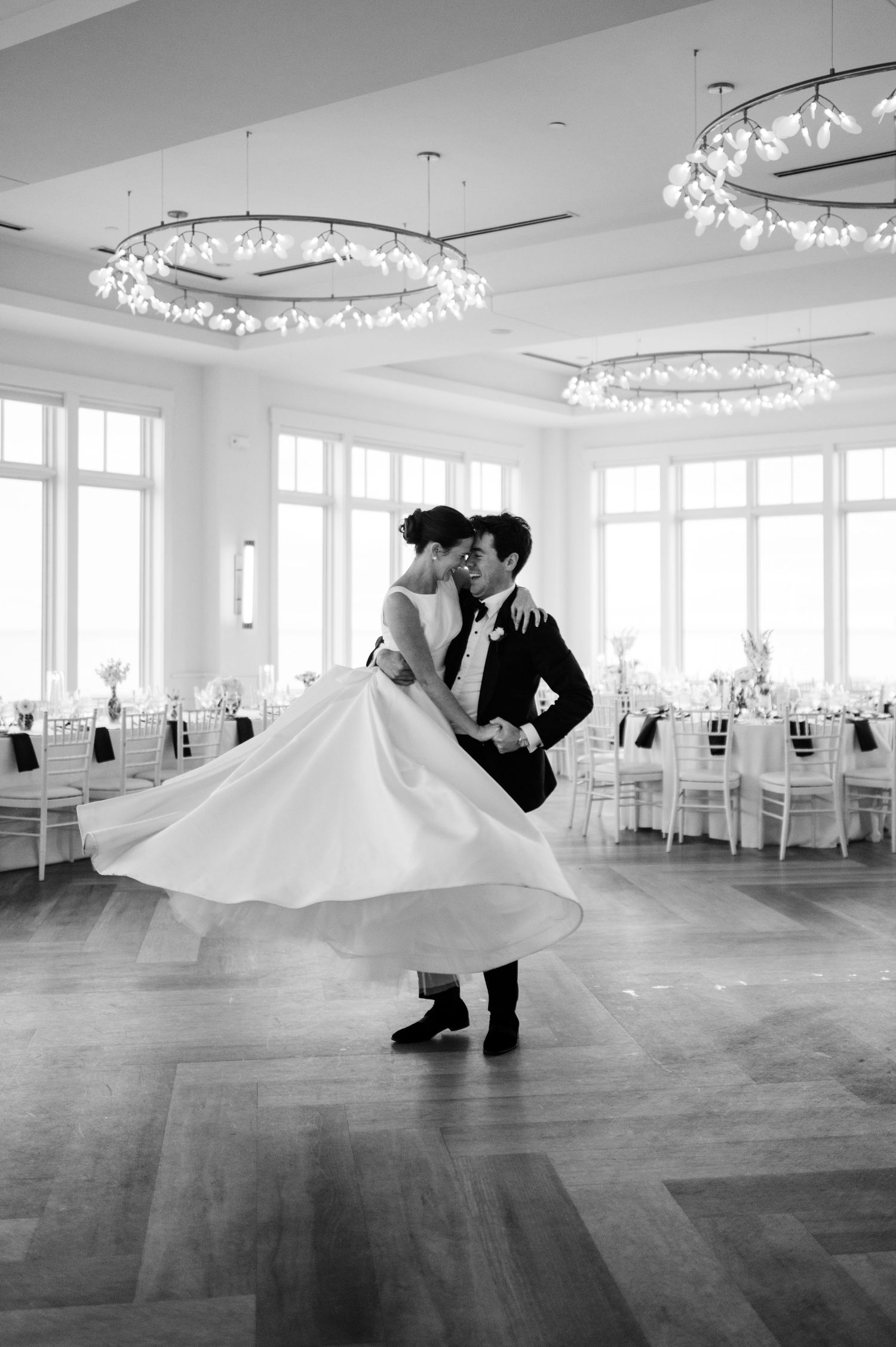 A romantic black and white panoramic sequence shows a couple dancing in an elegant ballroom with crystal chandeliers.