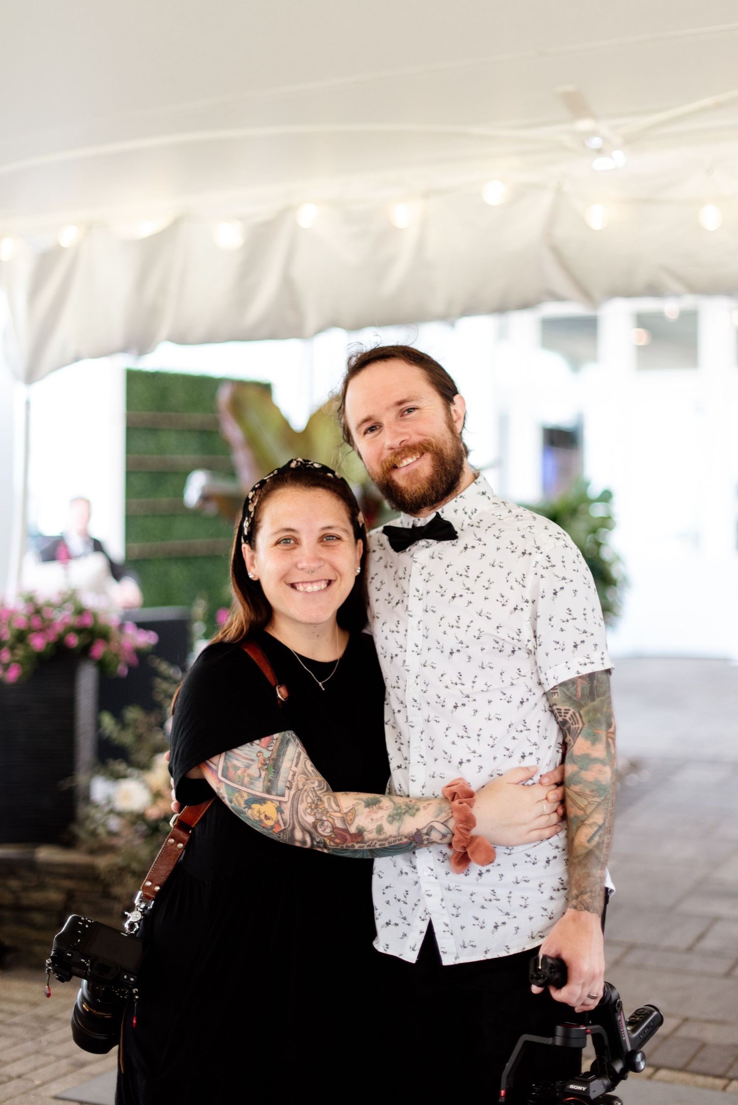 A couple in black and white attire share joyful moments together in a series of candid photos outdoors.