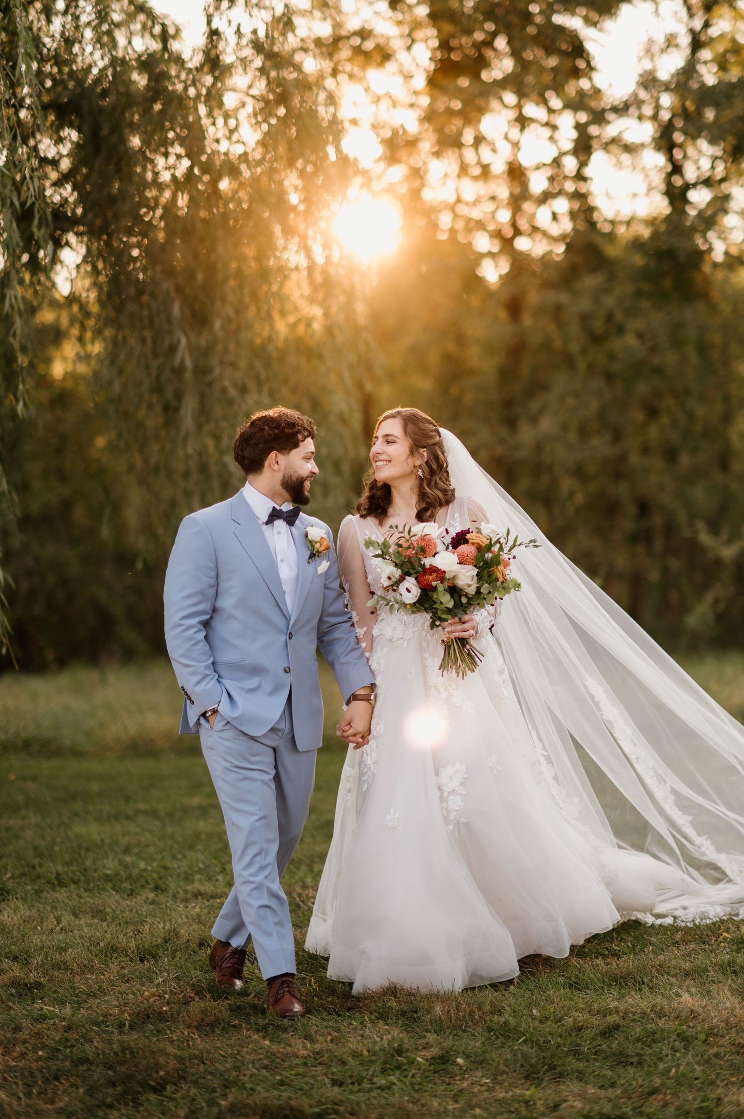 Golden sunset wedding photography featuring couples in formal attire with flowing veils.