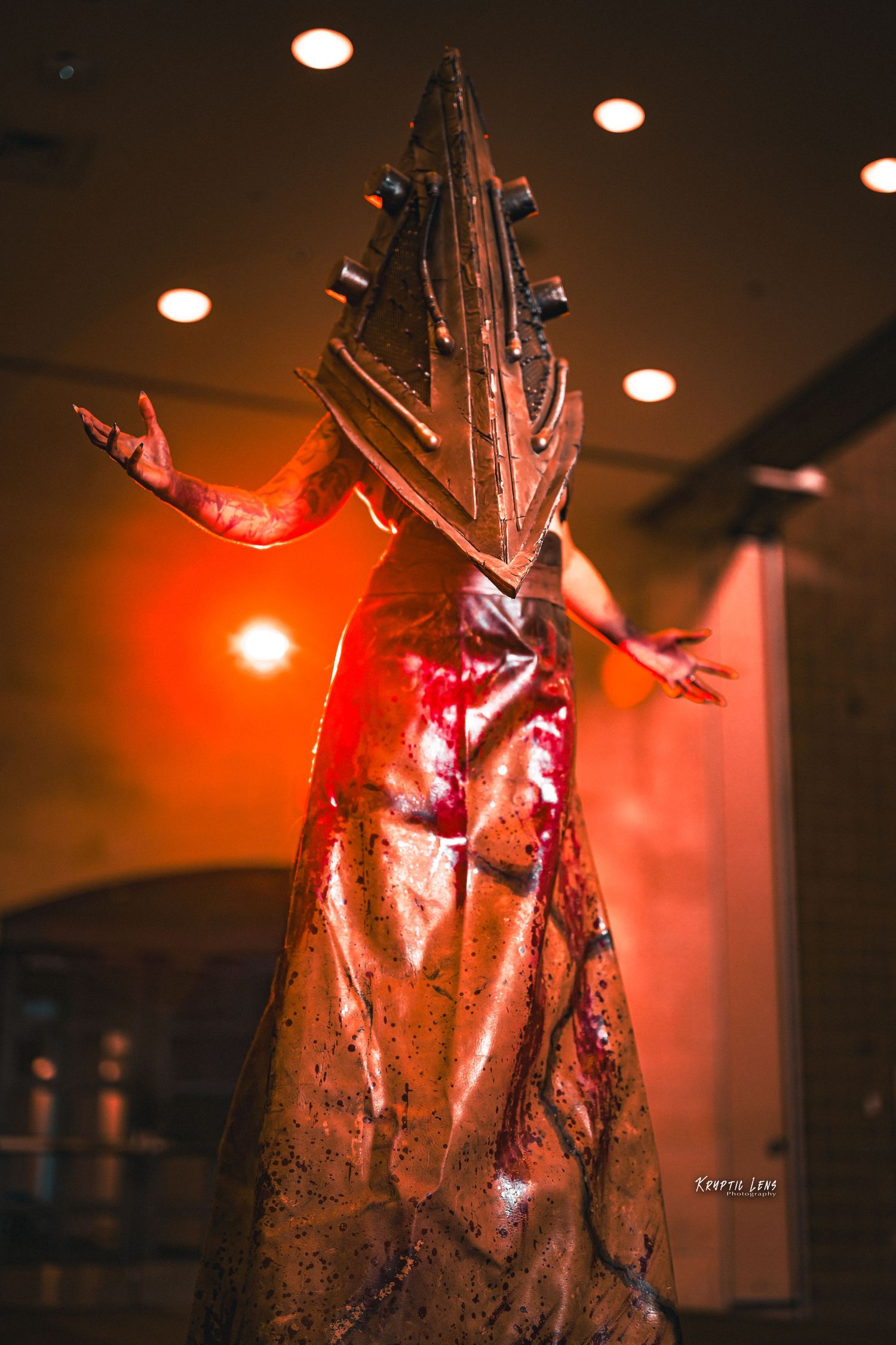 Dramatic red-lit figure in textured costume photographed from multiple angles.