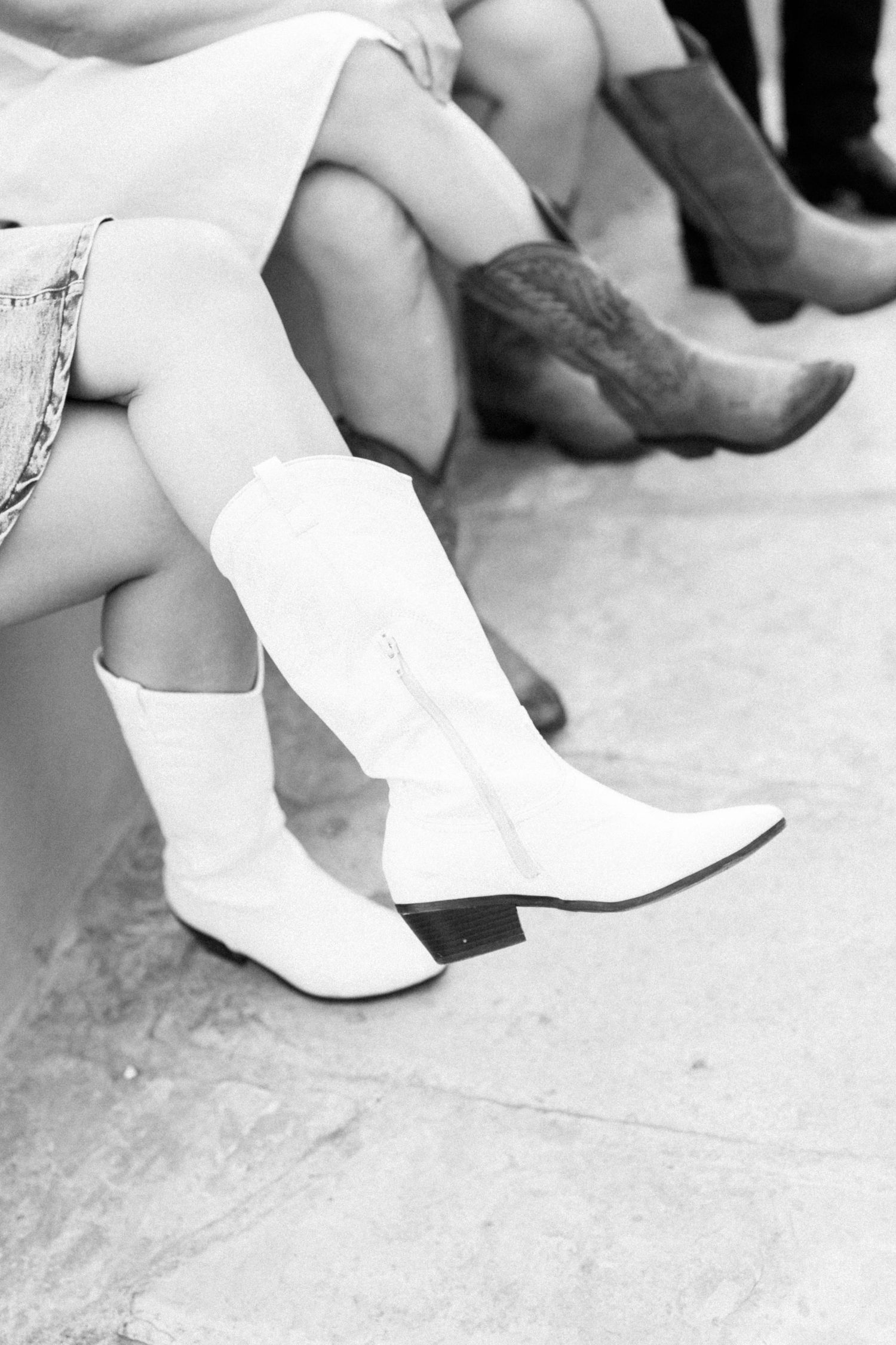 Wedding guests wearing cowboy boots at rehearsal dinner in Marathon, Texas