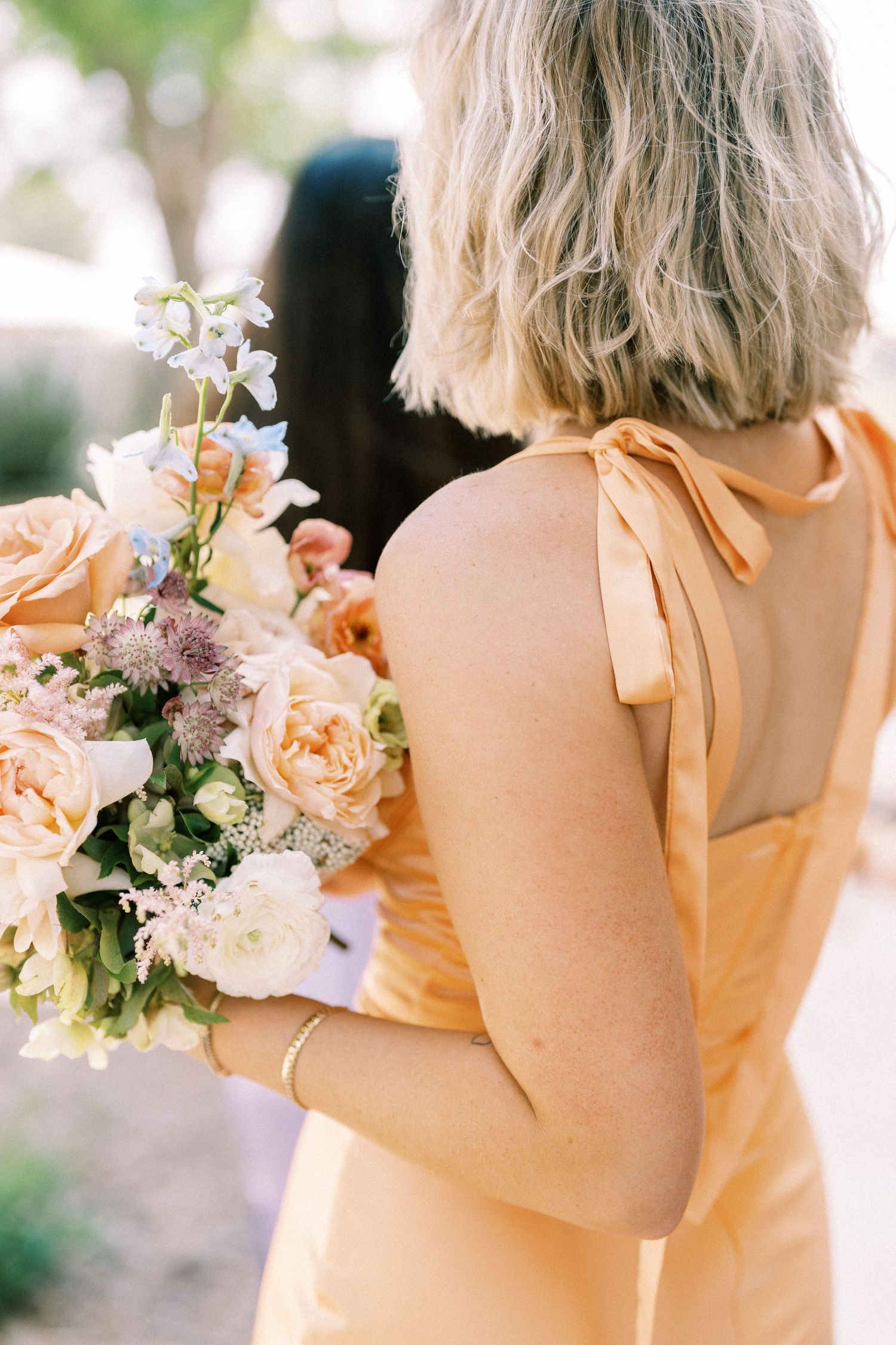 bridesmaid holding bouquet