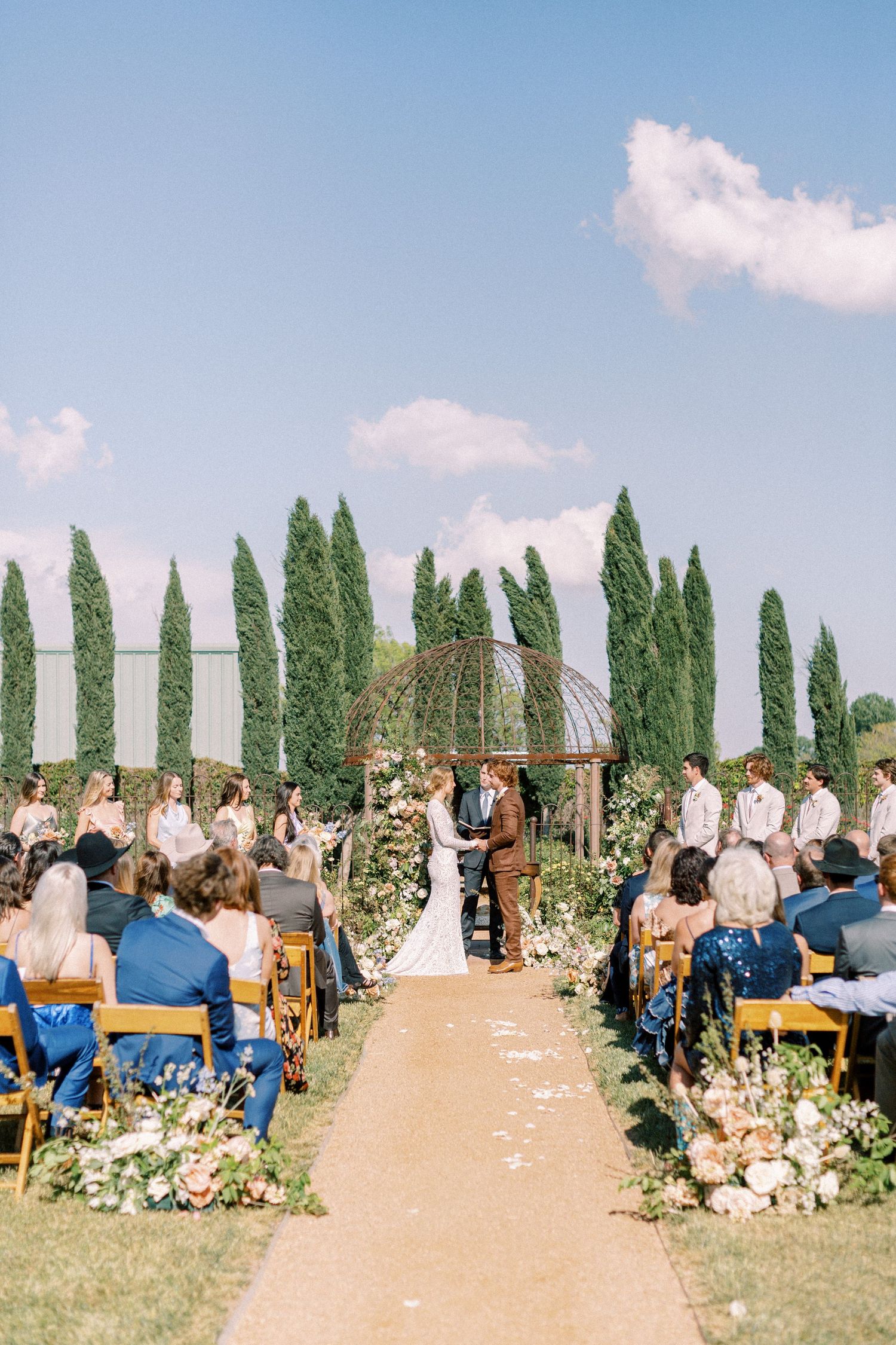 Bride and groom exchanging vows at The Gage Hotel in Marathon, Texas
