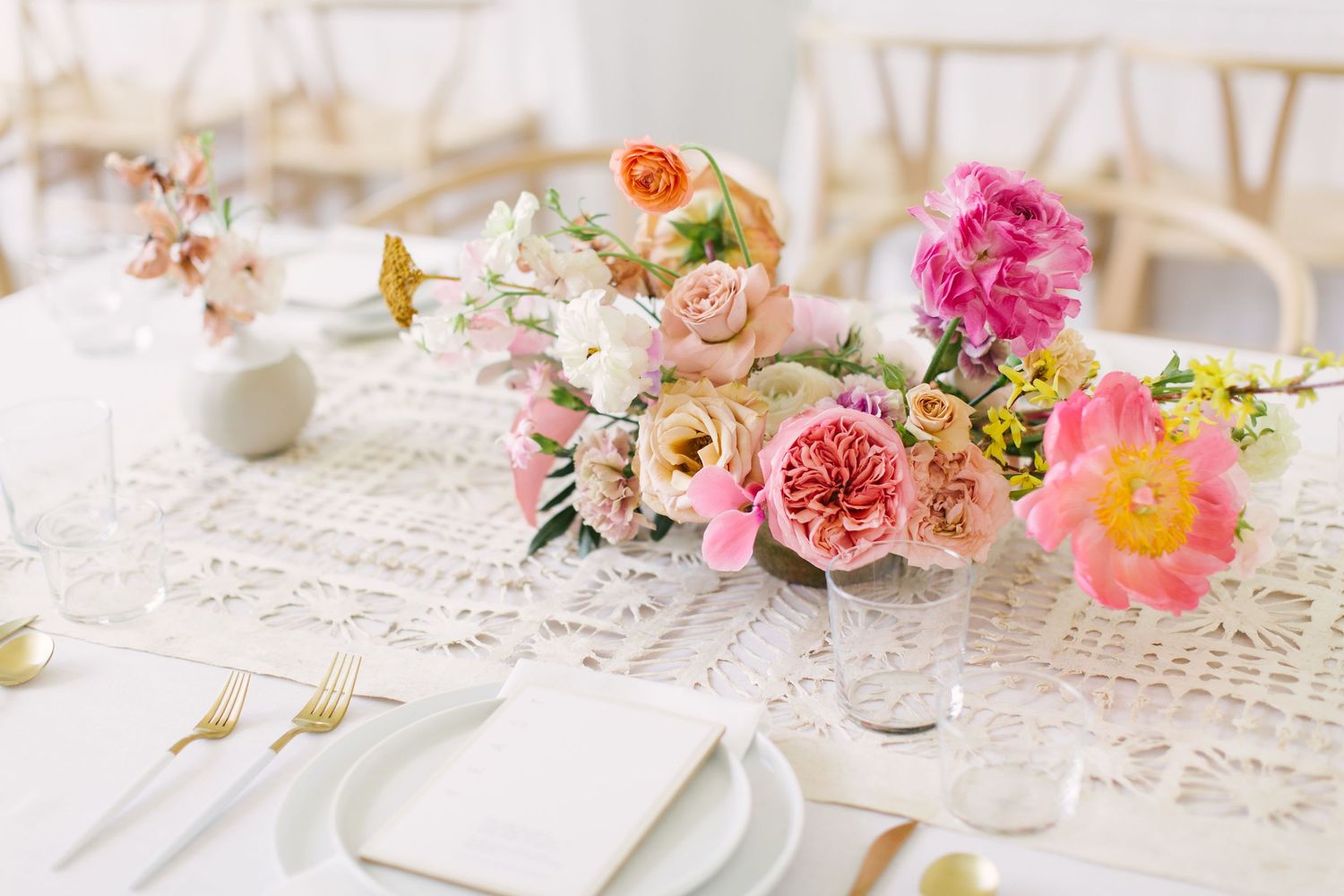 Light filled reception tables with beautiful flowers provided by Remi + Gold Floral Atelier