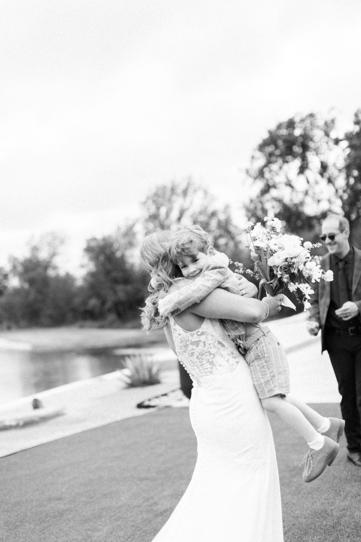 Black and white photos of joyful wedding celebration moments outdoors.