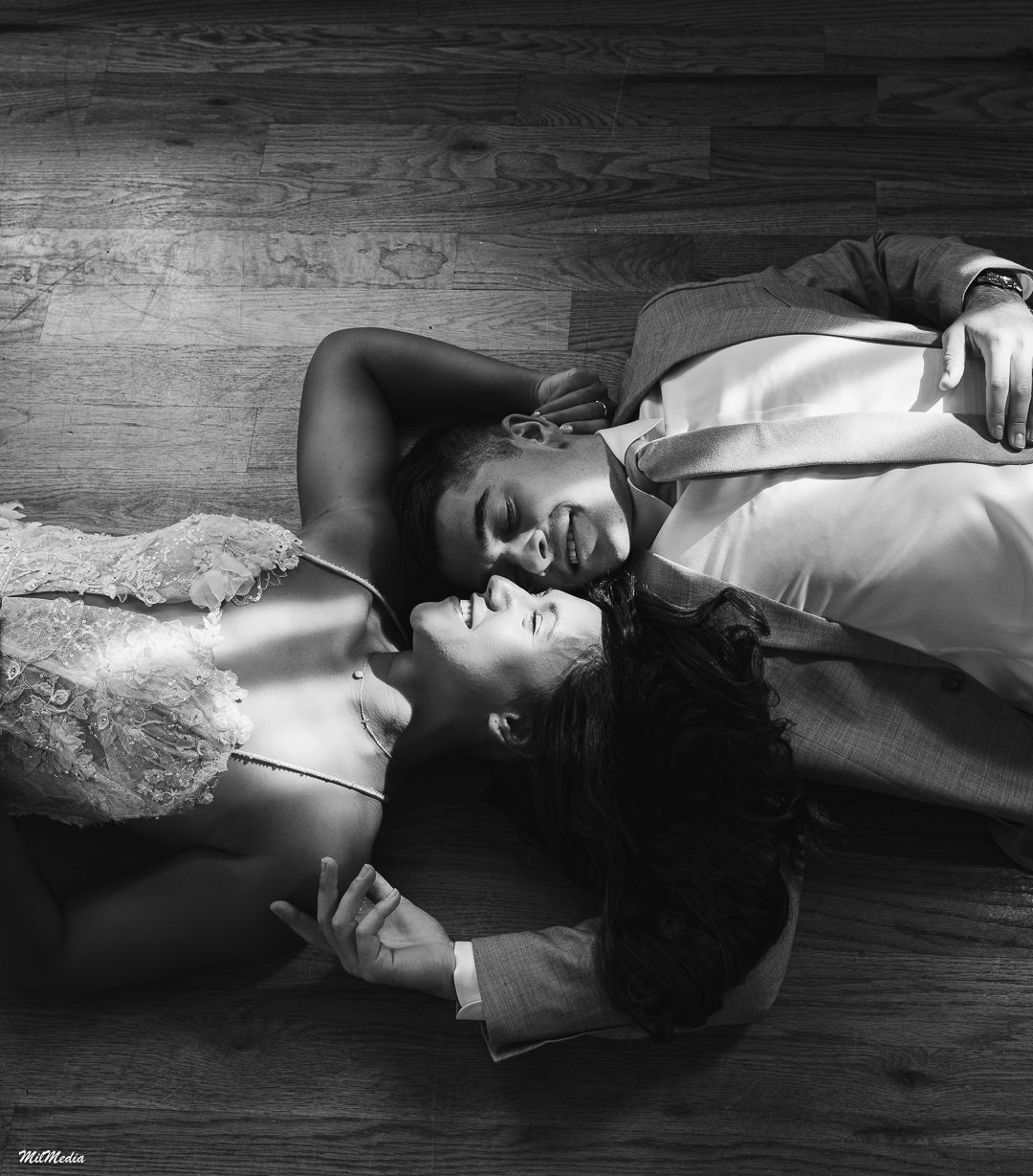 Moody black and white portrait sequence with dramatic shadows on dark wooden surface.