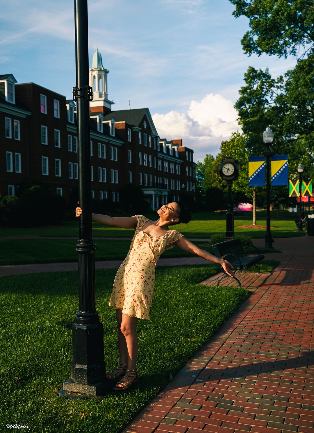A sequence of five photos shows someone in a yellow dress dancing playfully against a brick path and green lawn backdrop.