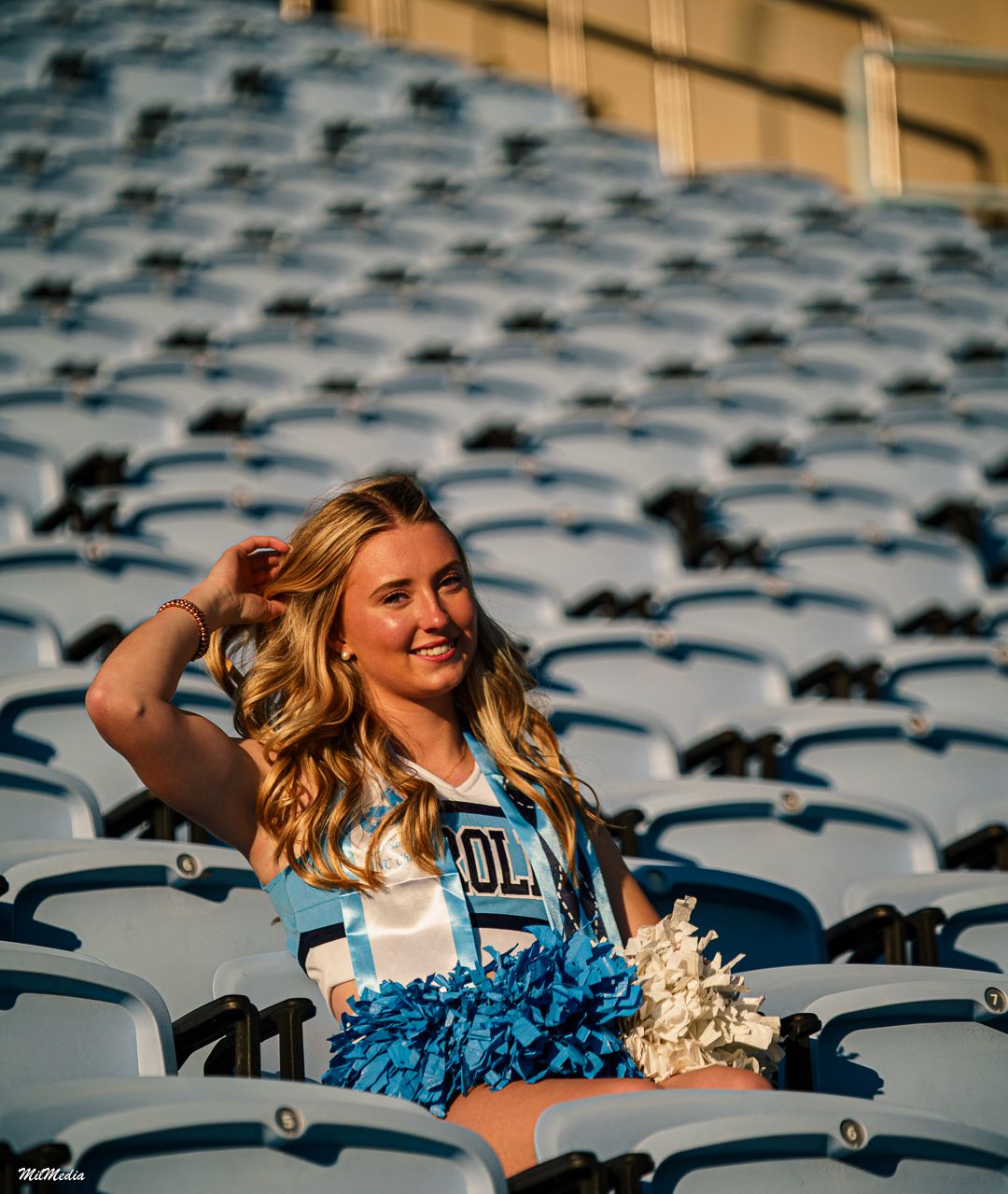 Cheerleader with blue pom poms poses dramatically across stadium seats in a dynamic photo sequence.