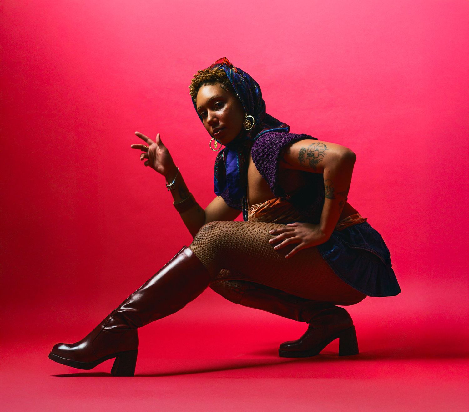 Dance sequence showing fluid movements and poses against bright red studio setting.