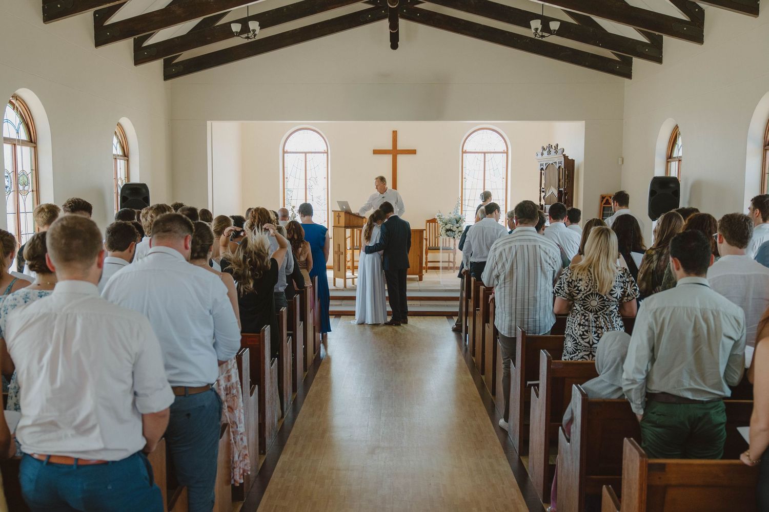 Bride and groom exchanging hug in chapel during Eastern Cape wedding