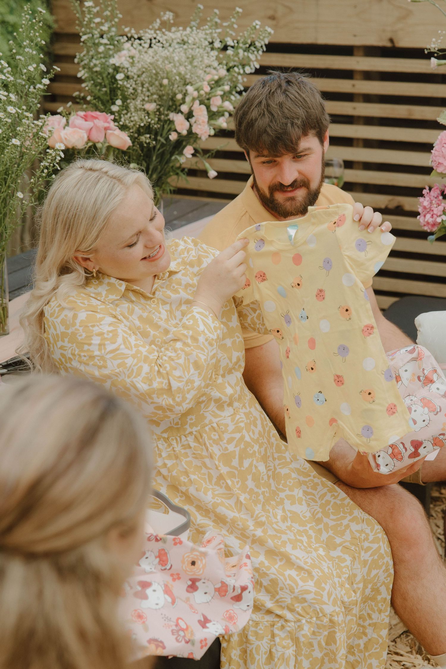 Mom-to-be opening gifts at intimate baby shower in Jeffrey’s Bay