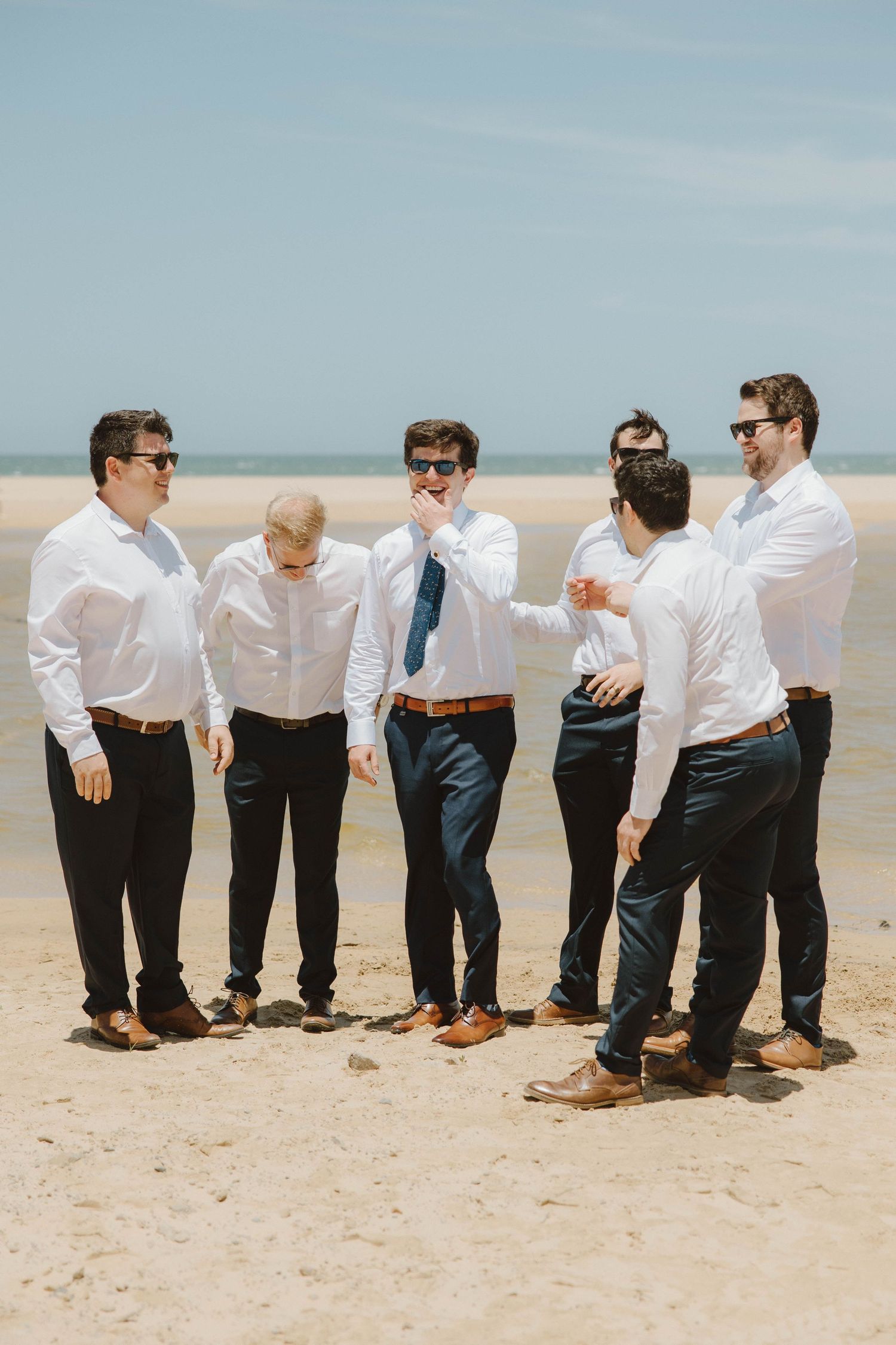 Groom and groomsmen on the beach before wedding ceremony in the Eastern Cape