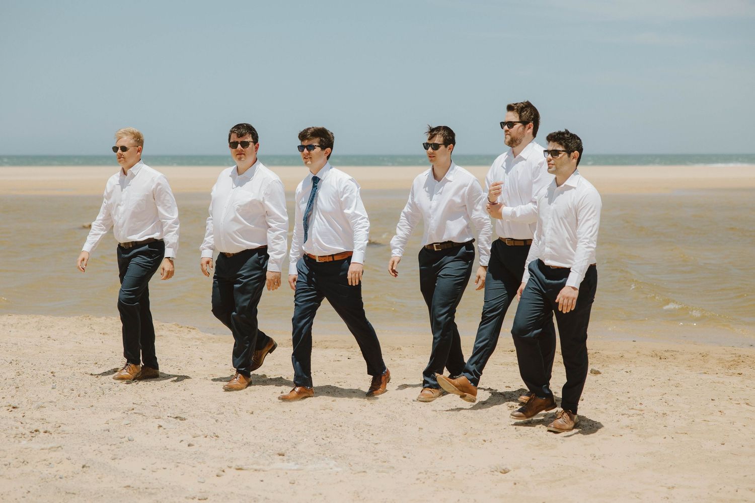 Groom and groomsmen on the beach before wedding ceremony in the Eastern Cape