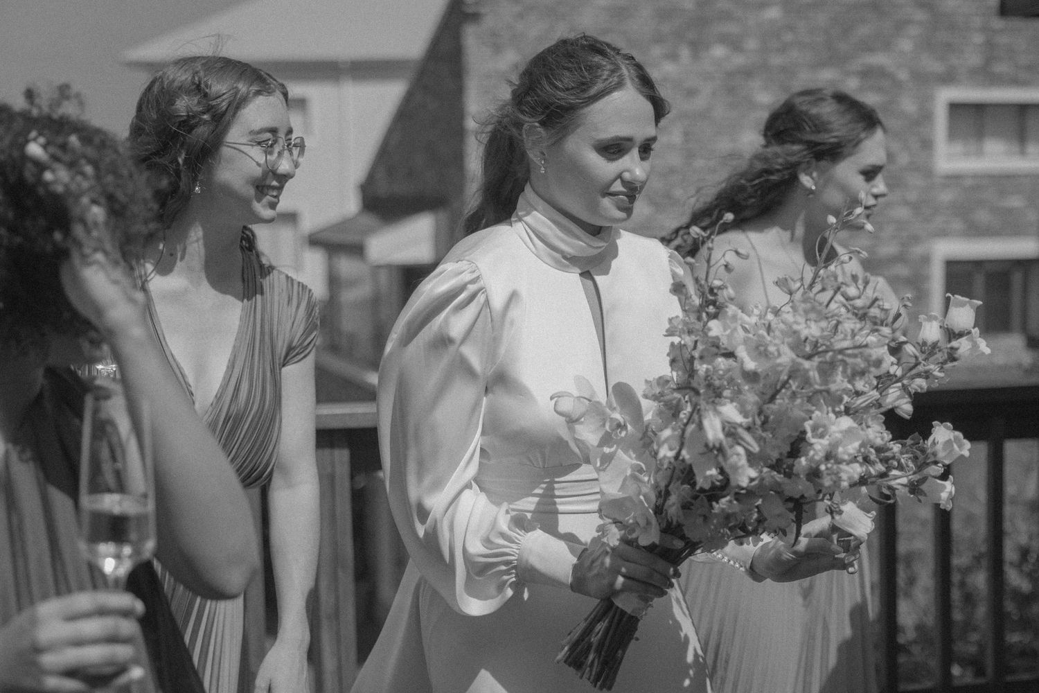 Bride with bridesmaids taking photos