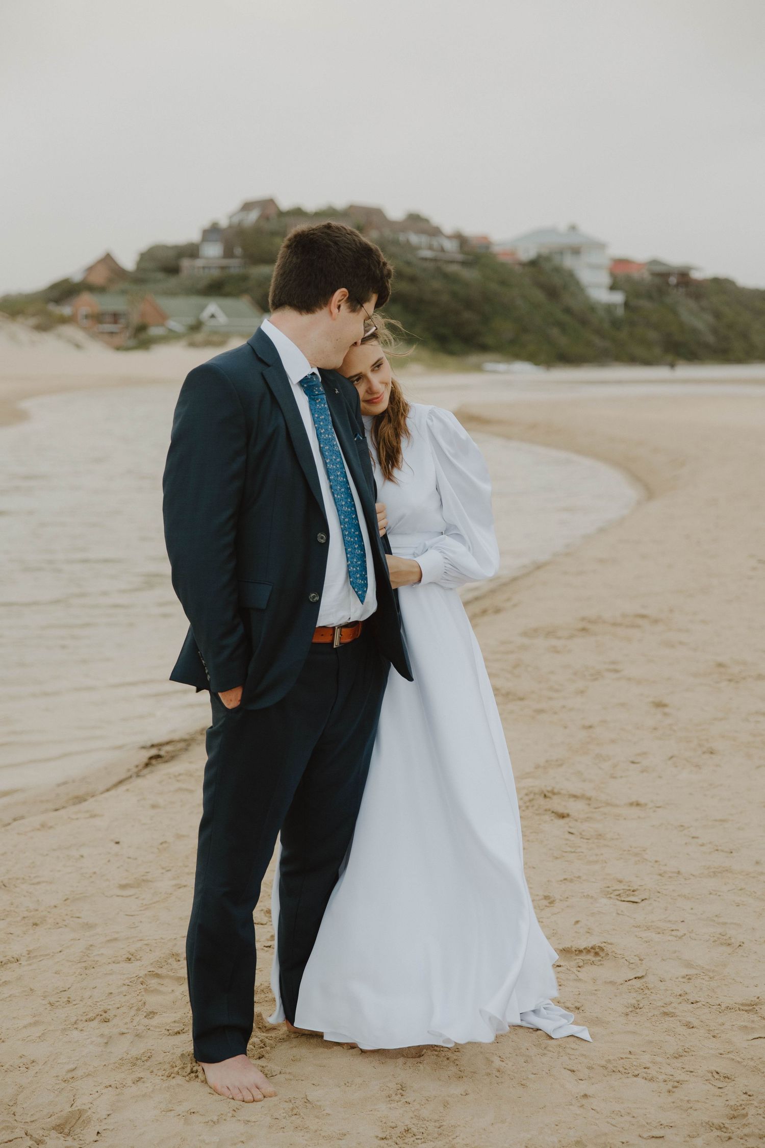 Romantic bride and groom portraits on beach in Eastern Cape