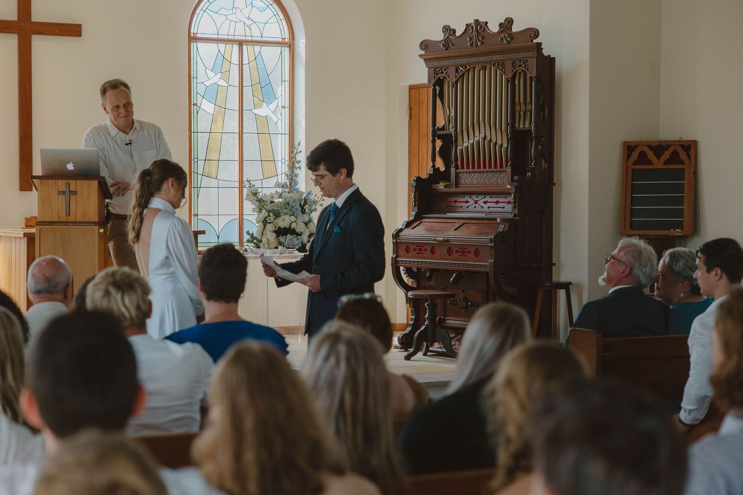 Bride and groom exchanging vows in chapel during Eastern Cape wedding
