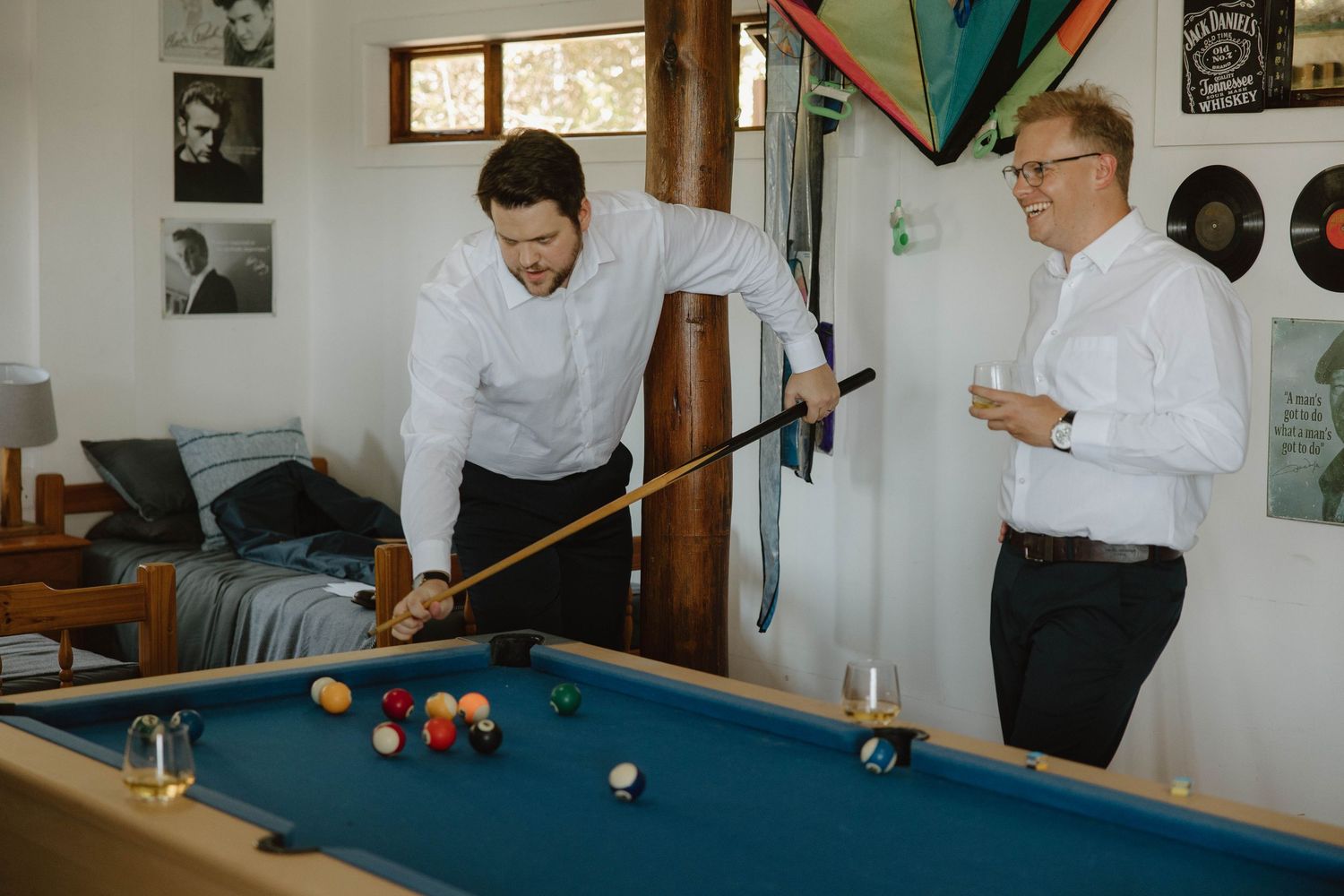 Groom and groomsmen playing pool before wedding ceremony in the Eastern Cape