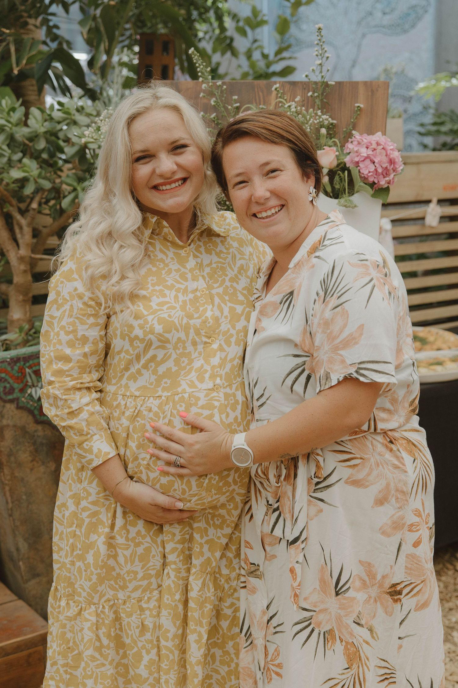 Mom-to-be and friend at baby shower celebration