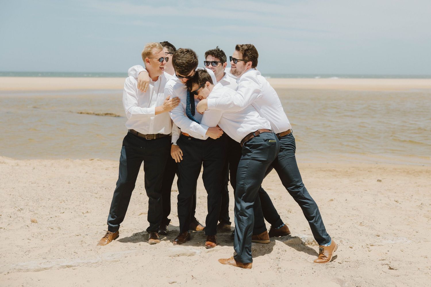 Groom and groomsmen on the beach before wedding ceremony in the Eastern Cape