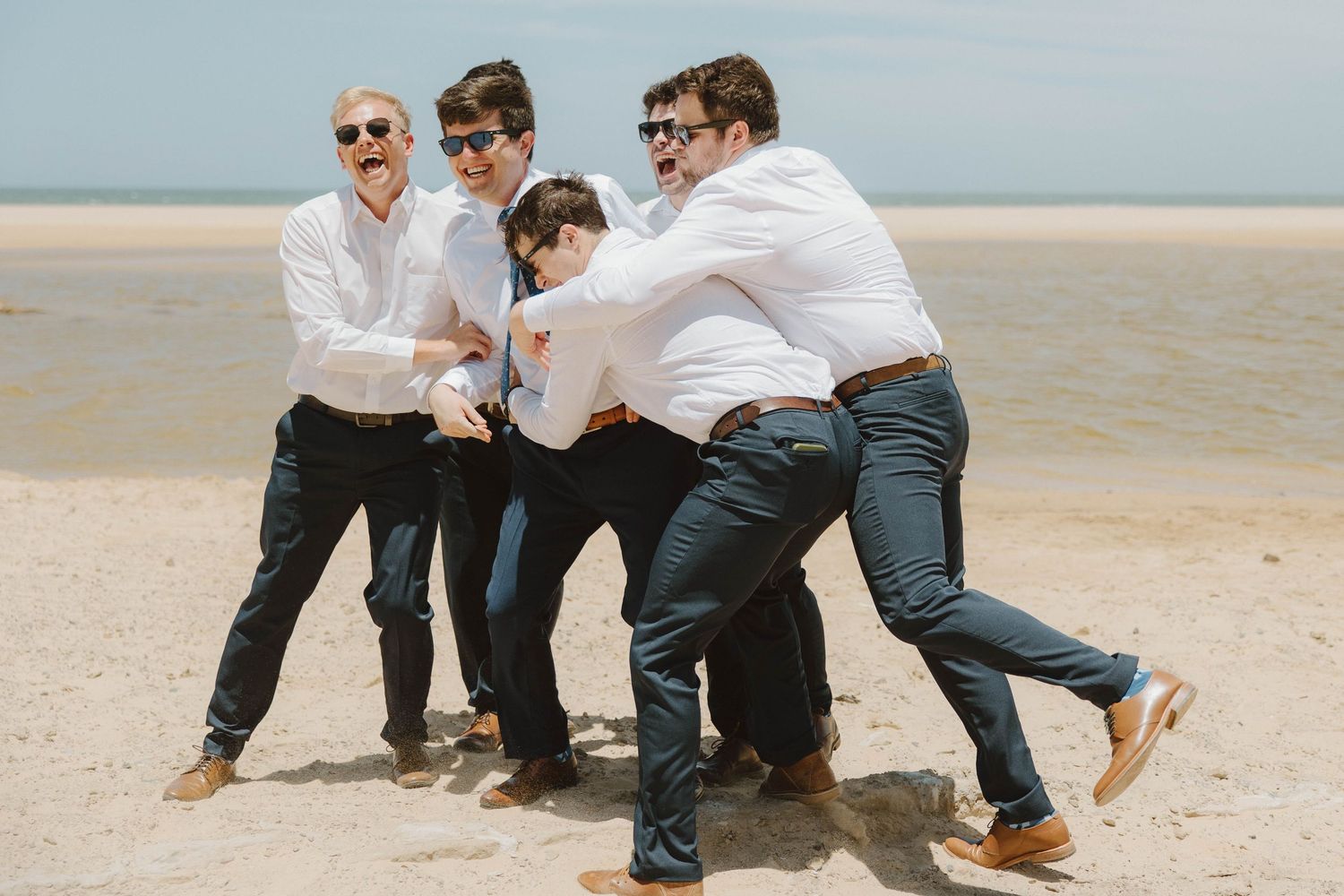 Groom and groomsmen on the beach before wedding ceremony in the Eastern Cape