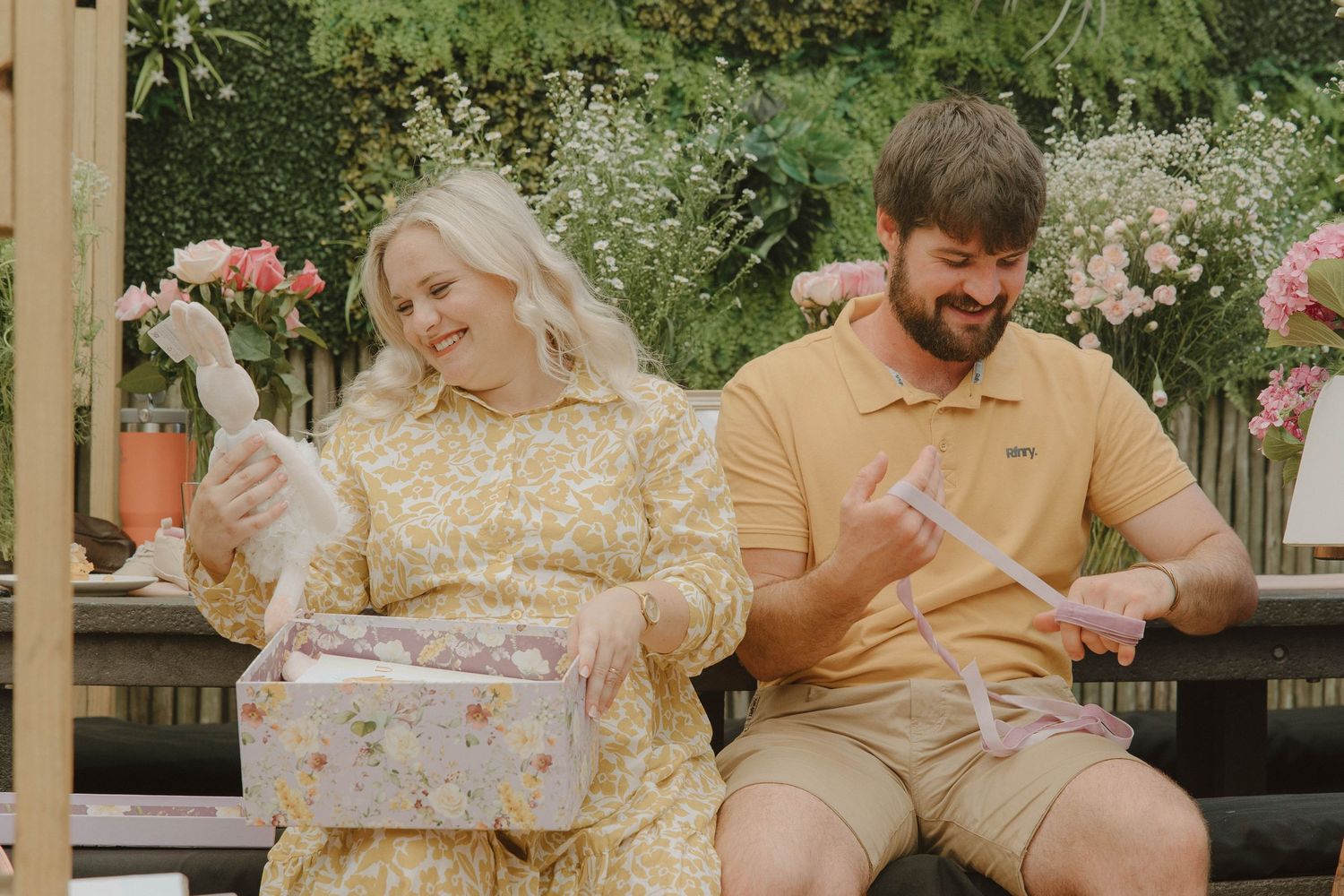 Mom-to-be opening gifts at intimate baby shower in Jeffrey’s Bay