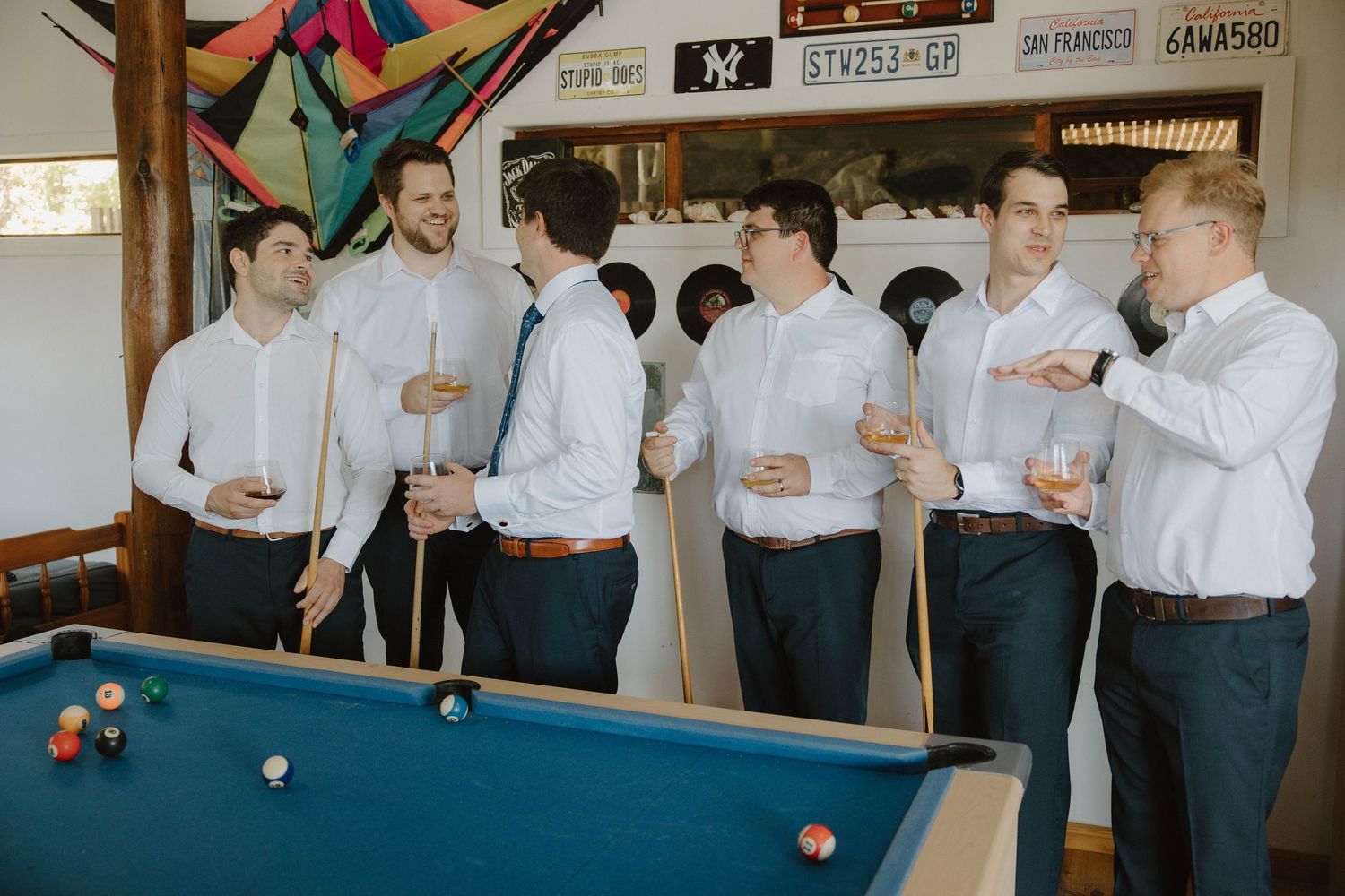 Groom and groomsmen playing pool before wedding ceremony in the Eastern Cape