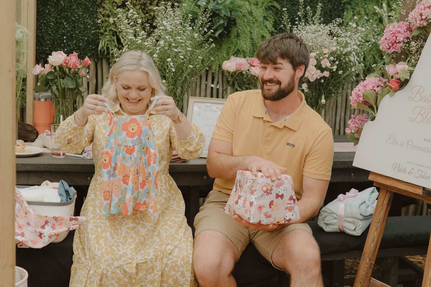 Mom-to-be opening gifts at intimate baby shower in Jeffrey’s Bay