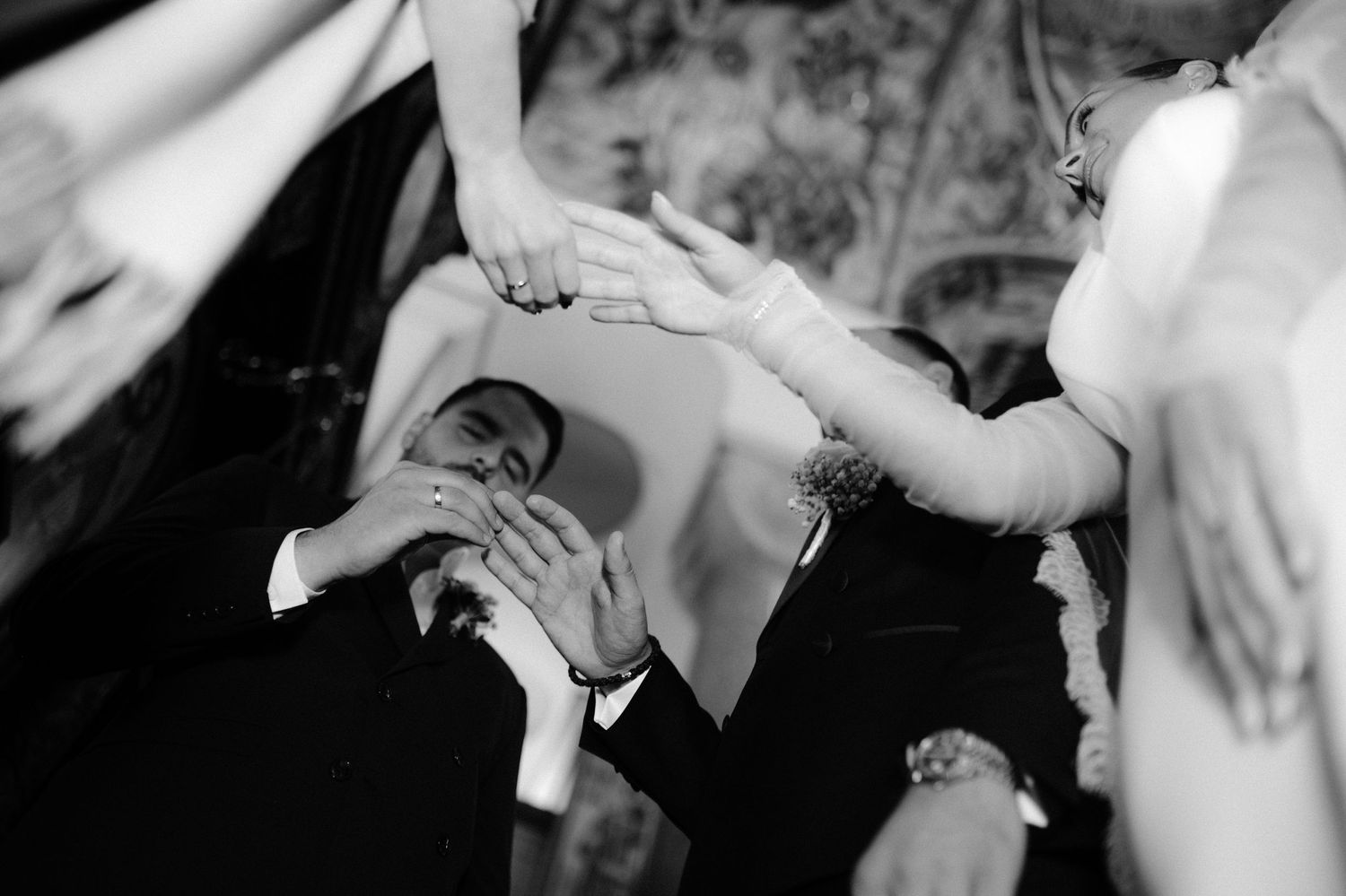 Black and white wedding photography collage showing intimate moments between couples during their celebrations.