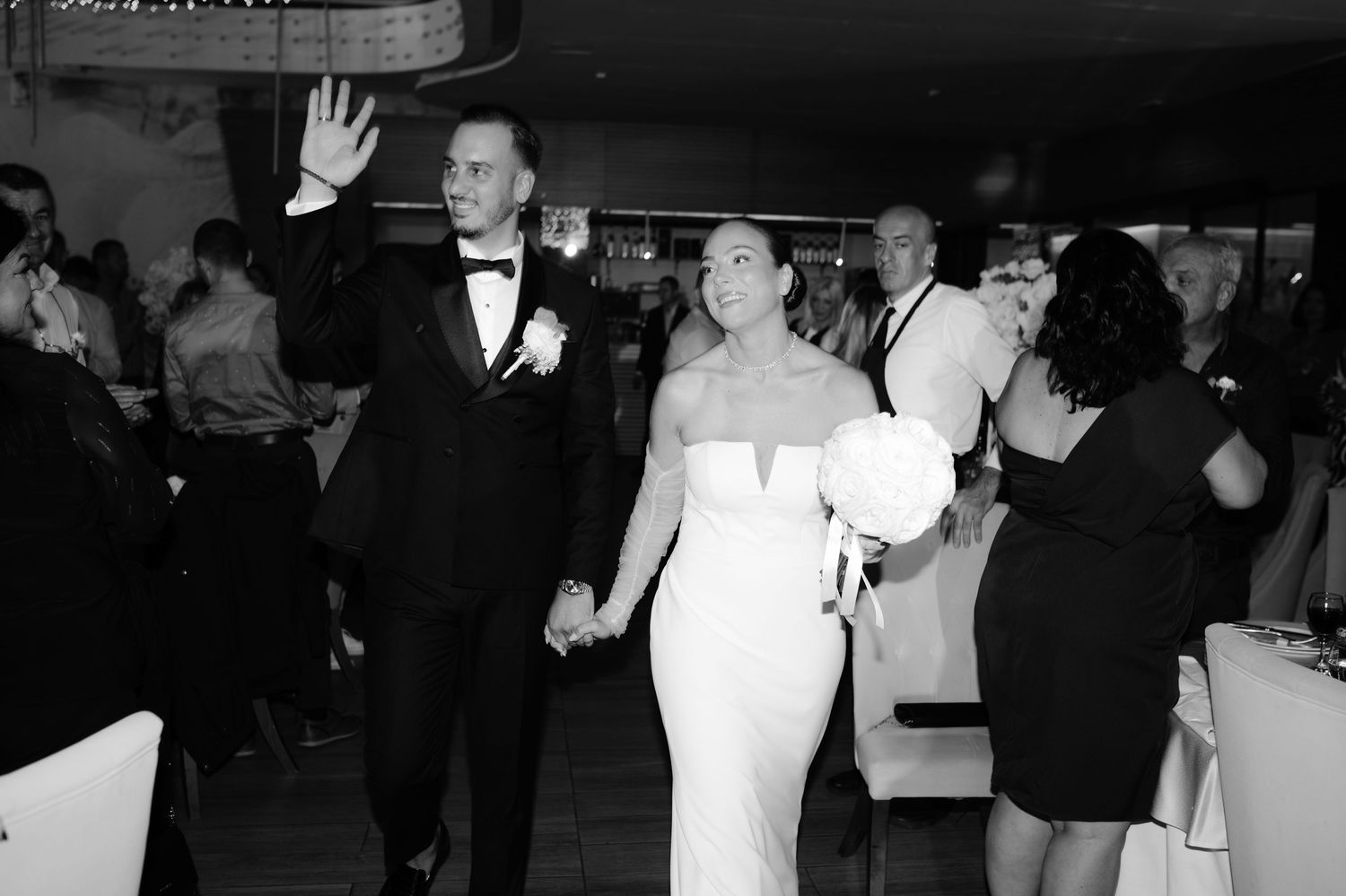 Black and white photos show a wedding reception with dancing and celebration at an indoor venue.