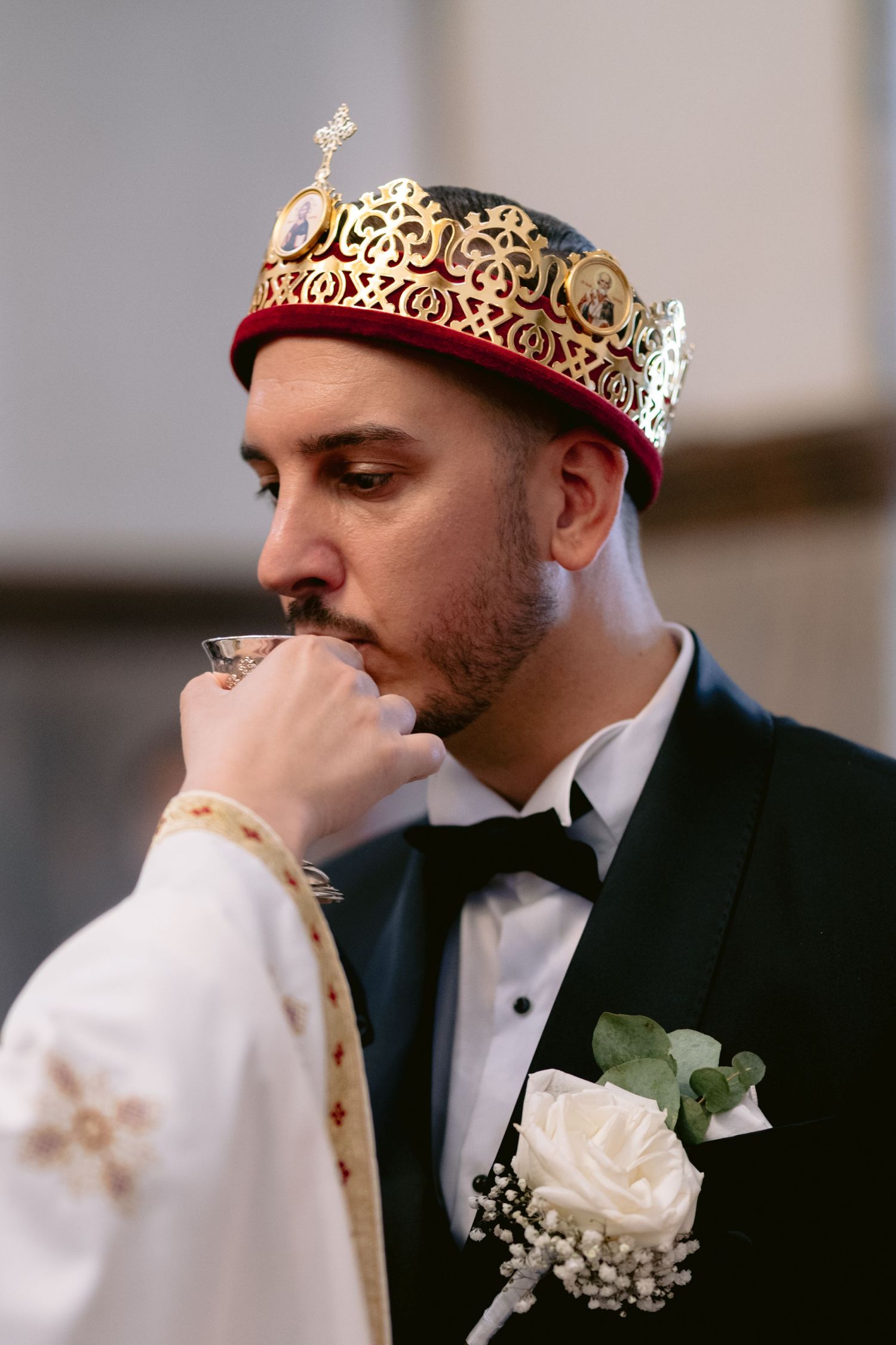 Black and white photo sequence showing a couple in formal wedding attire sharing a tender moment during their ceremony.