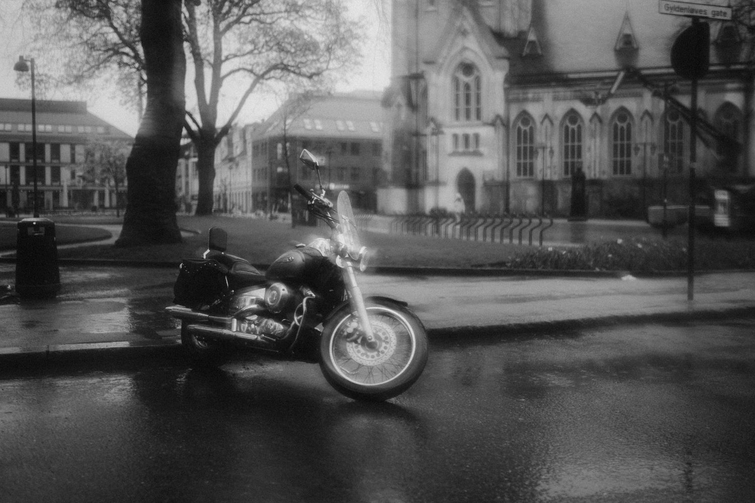 A collection of vintage black and white photographs showing street scenes and buildings from the early 20th century.