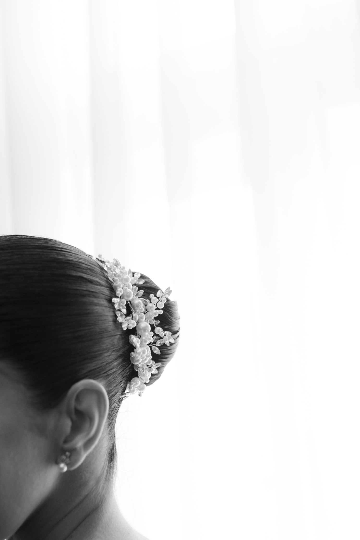Close-up detail of an ornate bridal hair accessory with crystal embellishments.