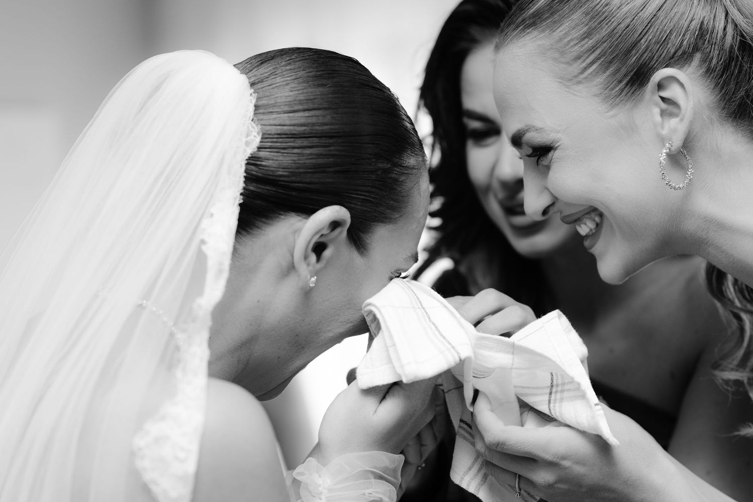 A series of black and white photos showing tender romantic moments between newlyweds during their wedding celebration.