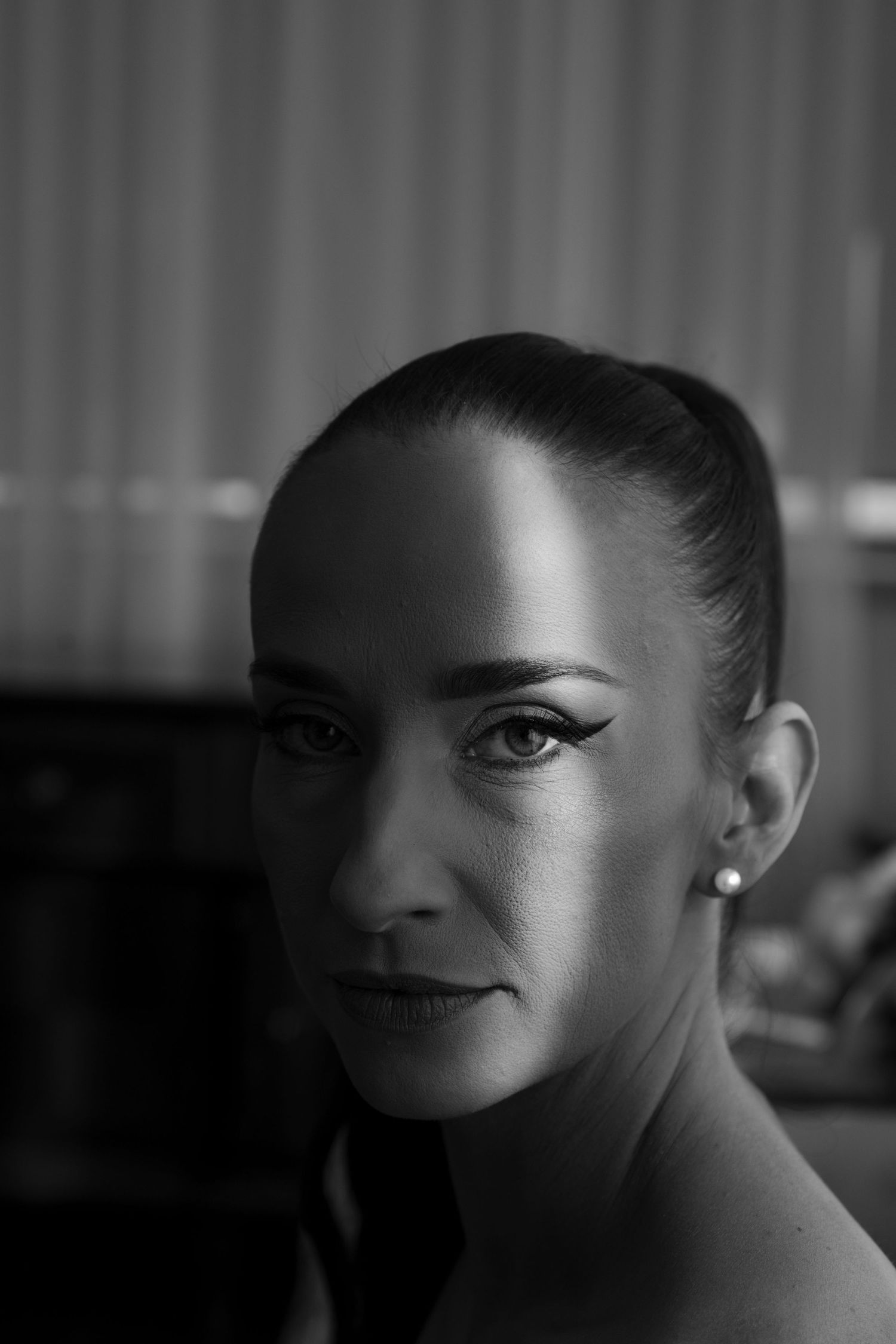 Dramatic black and white portrait series with moody lighting and shadows.
