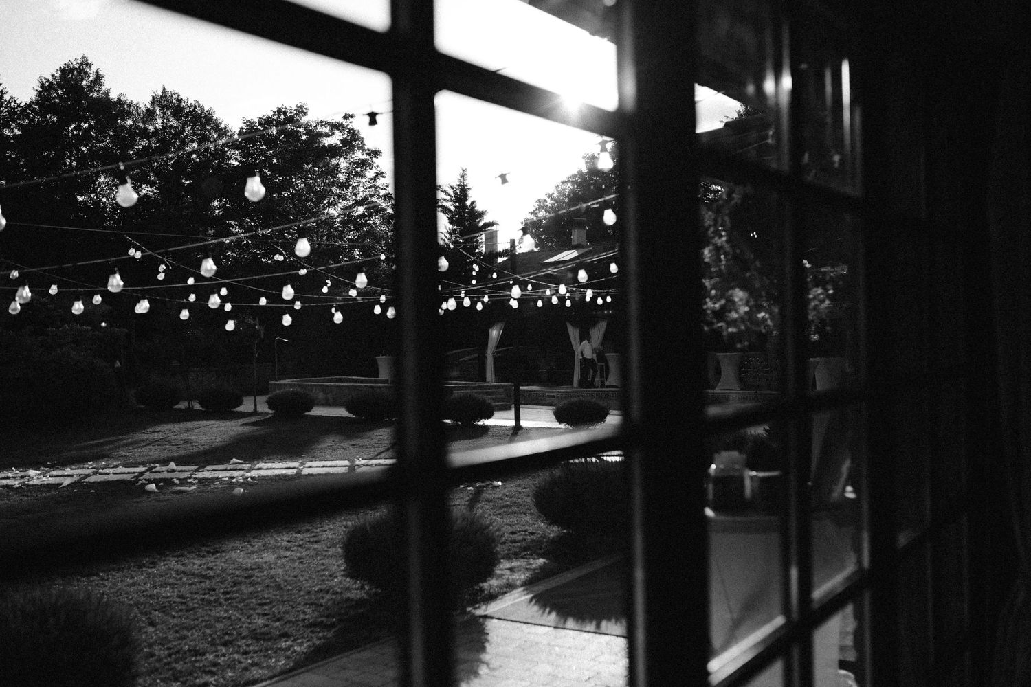 String lights create a magical silhouette against a twilight sky.