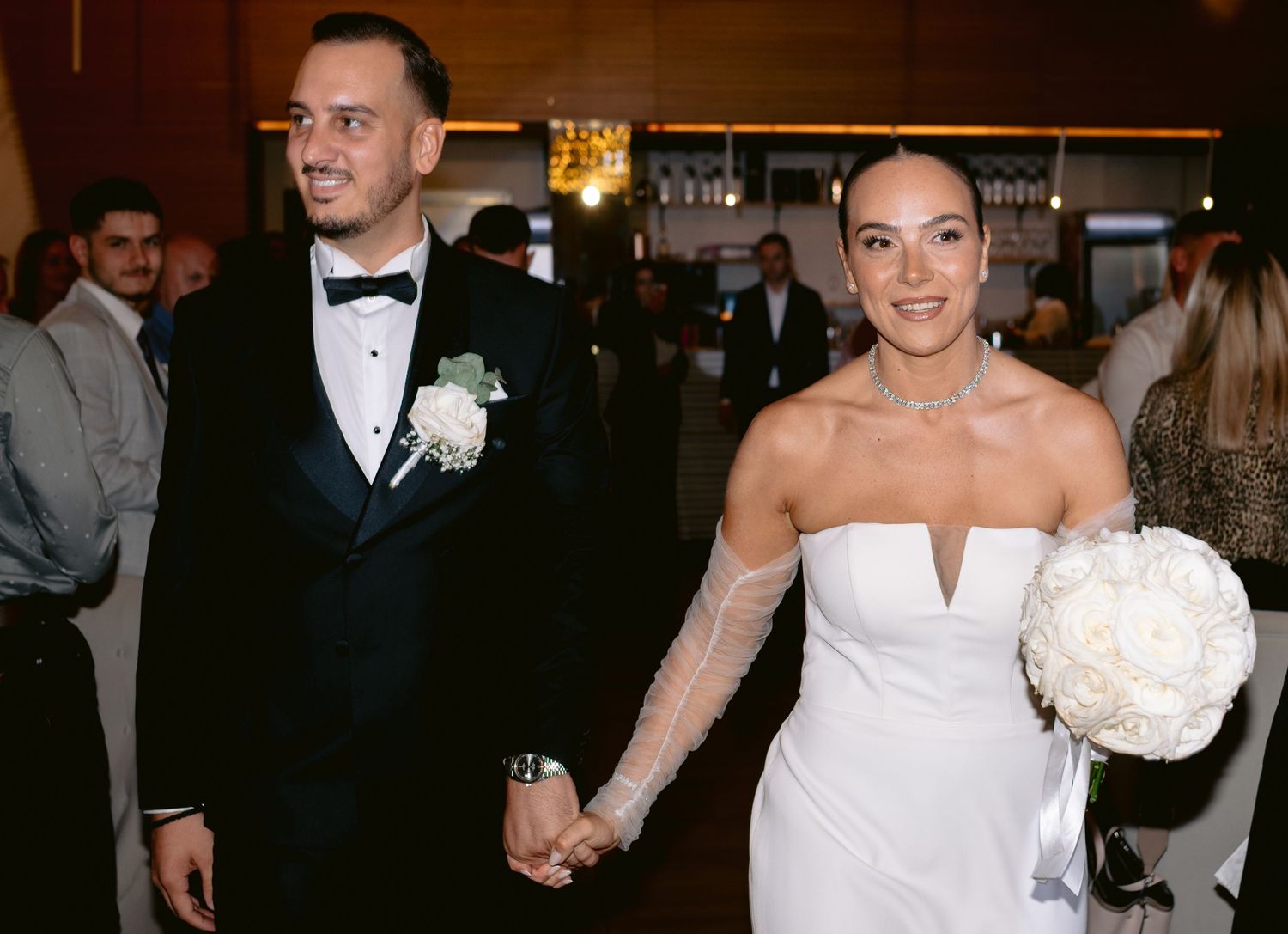 Wedding party celebrating at a reception with multiple candid moments of dancing and formal poses in formal attire.