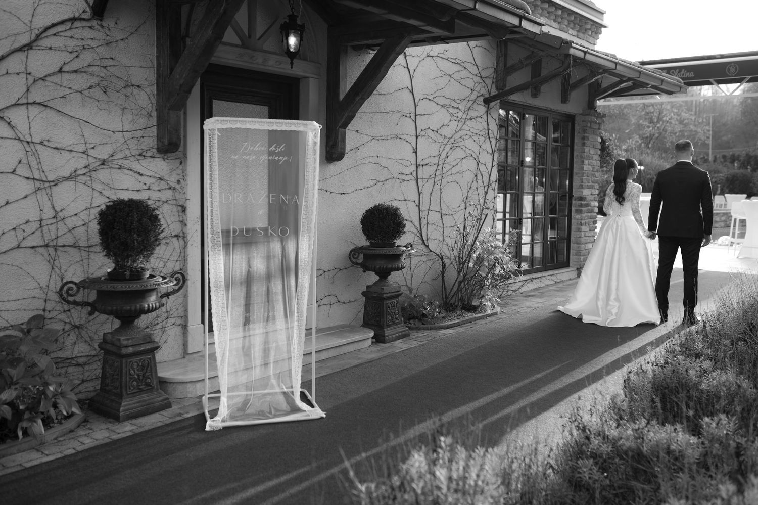 A sequence of black and white architectural photographs showing different angles of a modern building entrance.