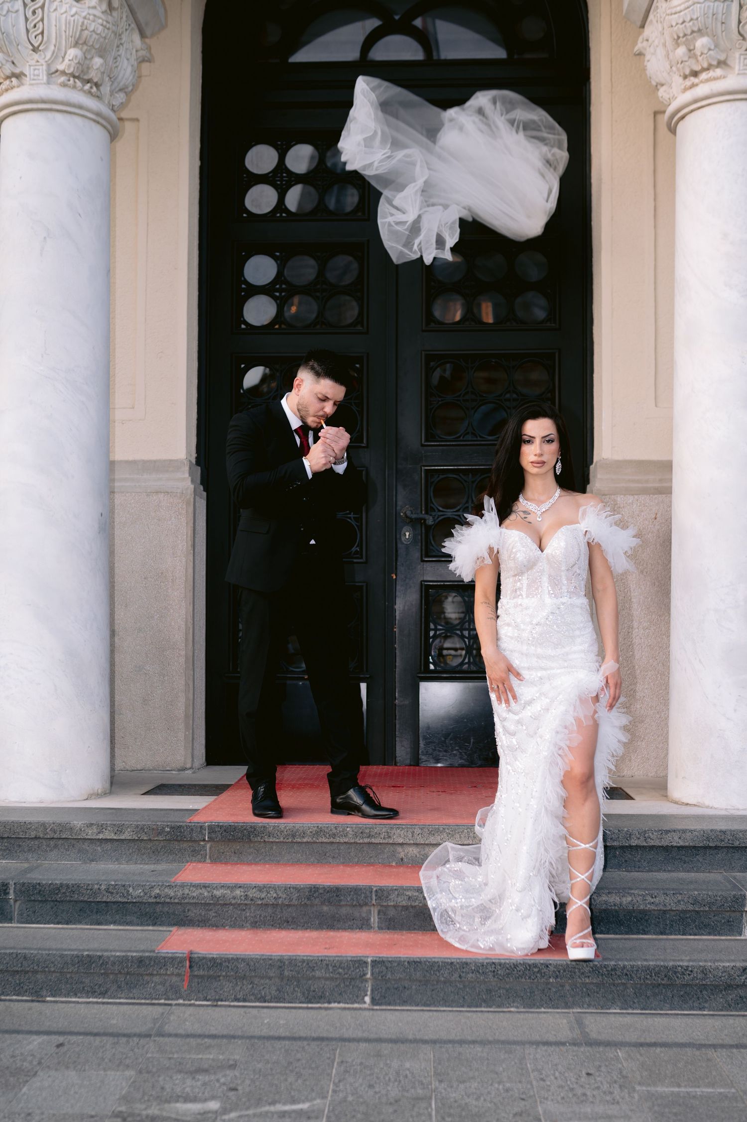 Artistic wedding photo sequence showing couple posing playfully on grand stone steps with white columns.
